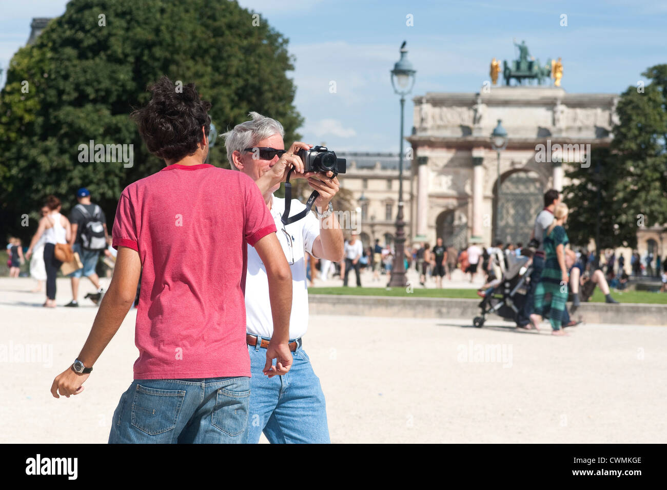 Paris, France - July  2012 -  Father and son playing with camera around the Louvre Museum area. Stock Photo
