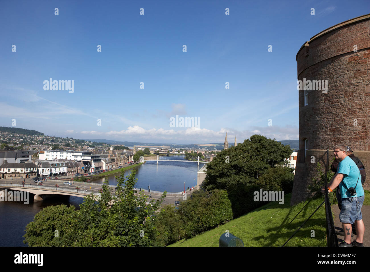tourists looking down over river ness flowing through inverness city highland scotland uk Stock Photo