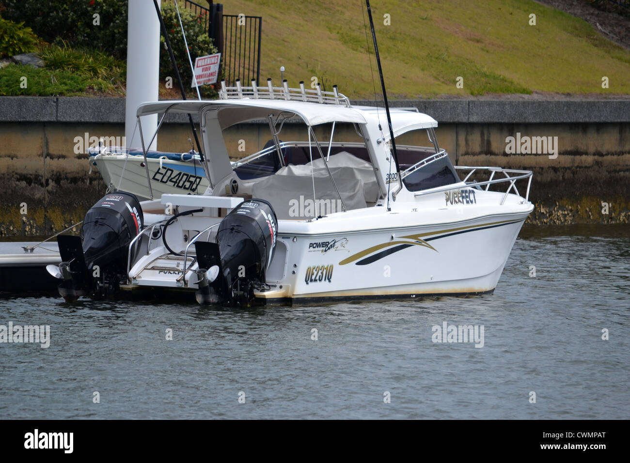 Twin outboard boat at a pontoon on the canal Stock Photo Alamy