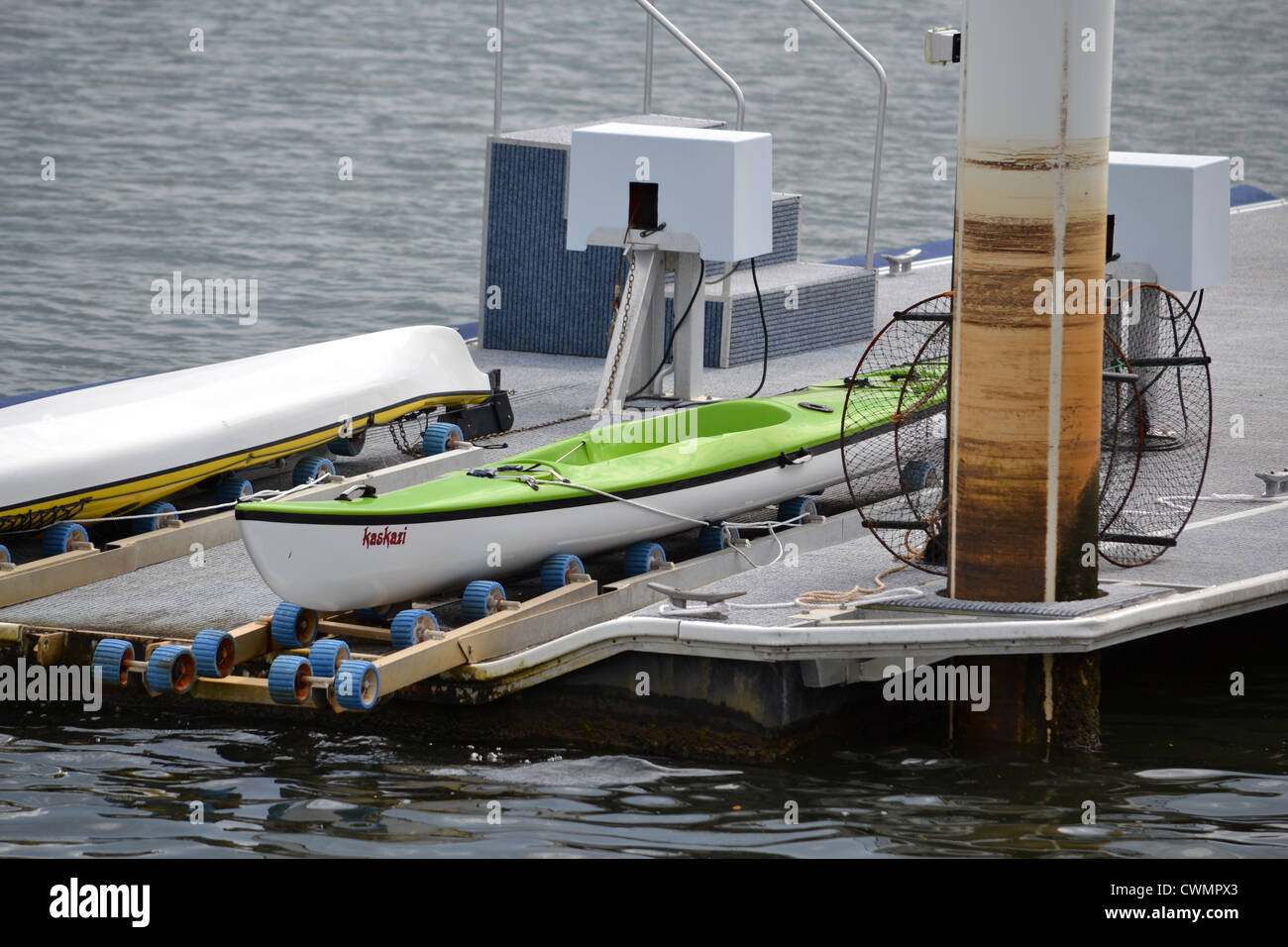 canal pontoon with kayaks Stock Photo