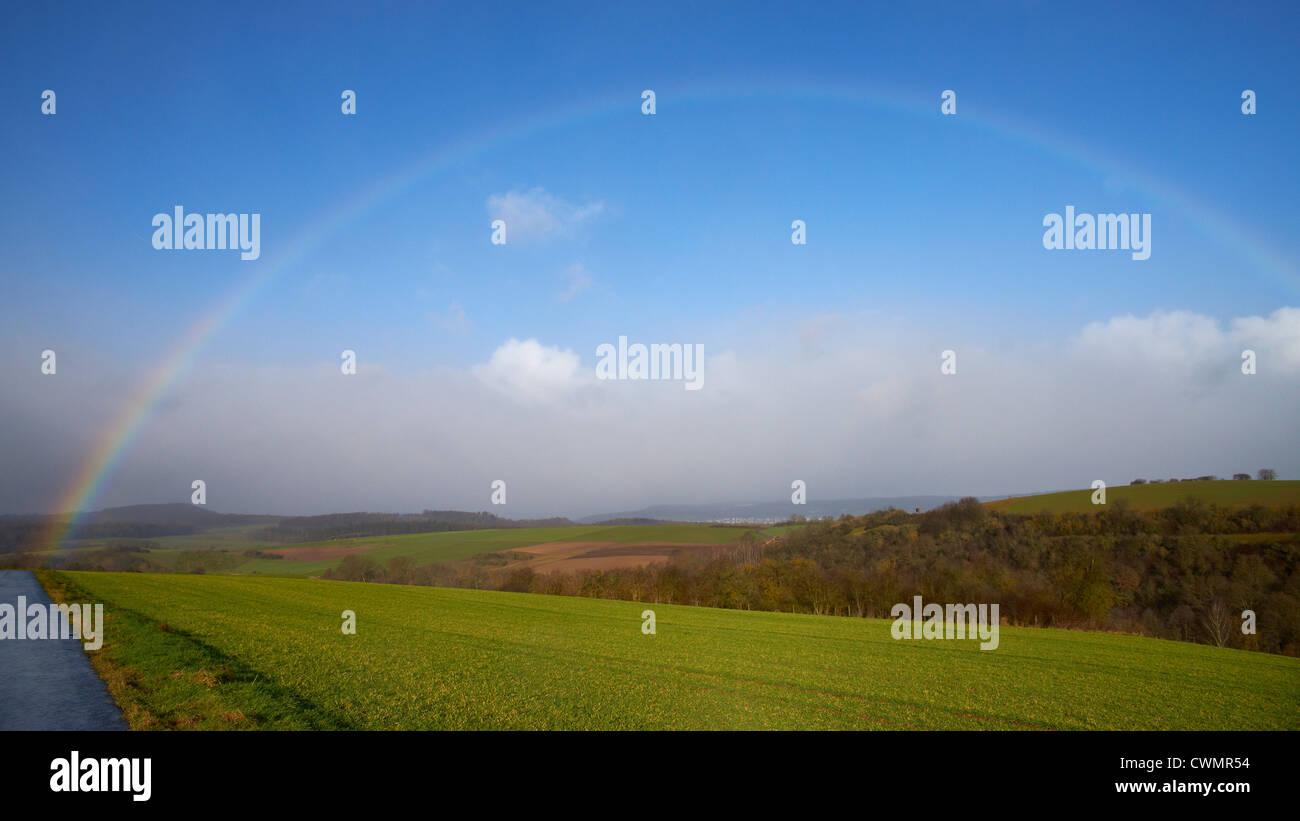 Rainbow in an almost blue sky Stock Photo - Alamy