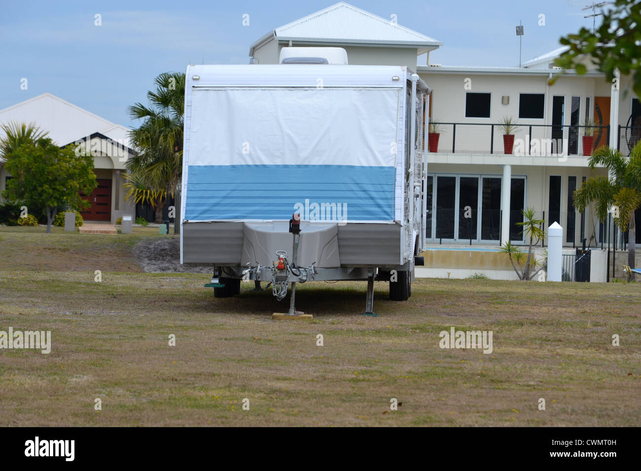 Owners of a canal block of land staying in there caravan on said land Stock Photo