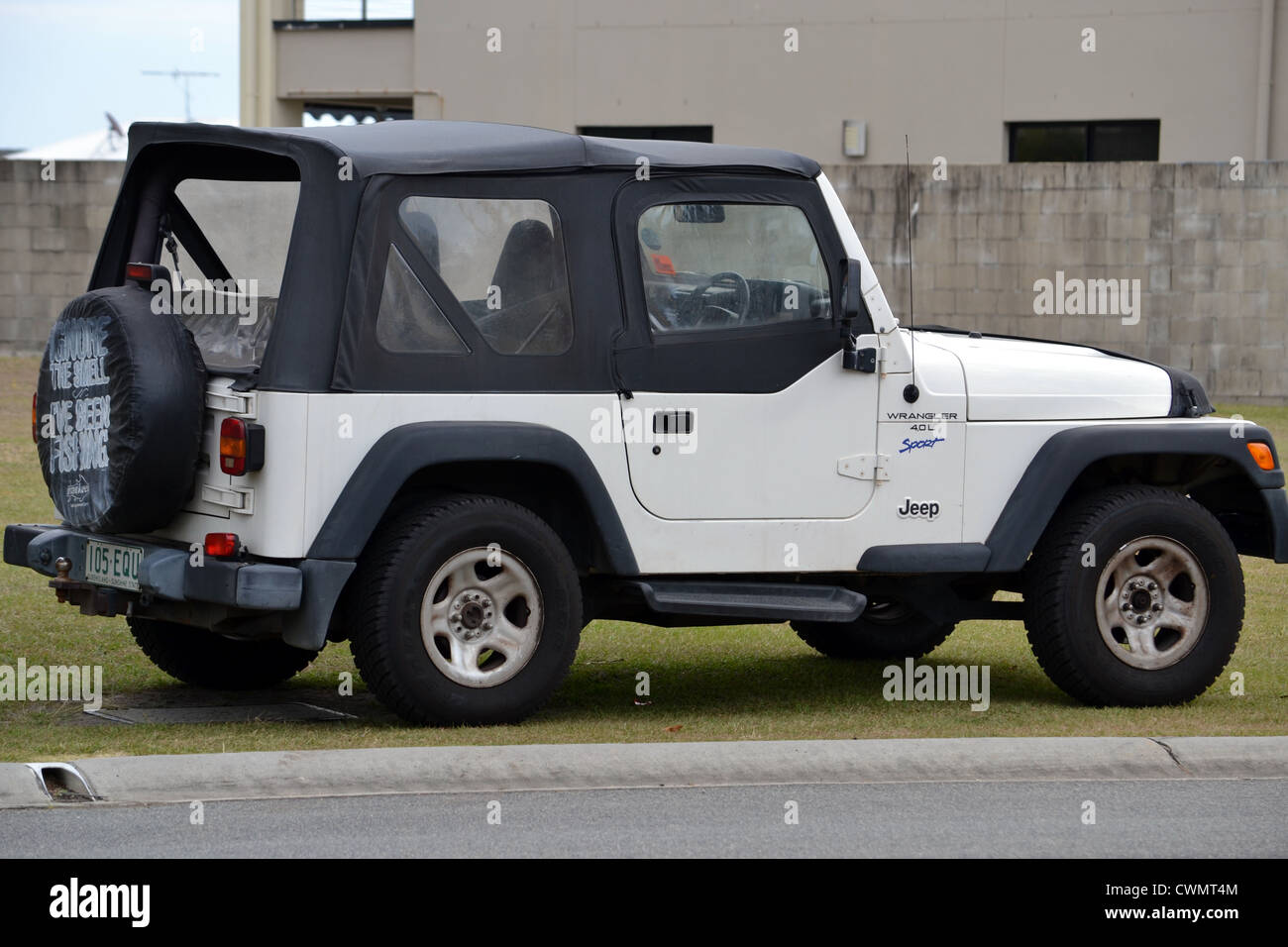 jeep wrangler sport parked on footpath Stock Photo - Alamy