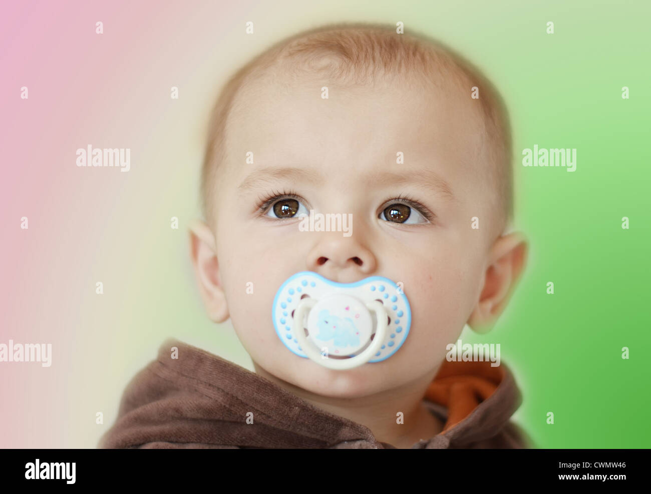 Baby Boy Face with Big Brown Eyes with Dummy Stock Photo Alamy