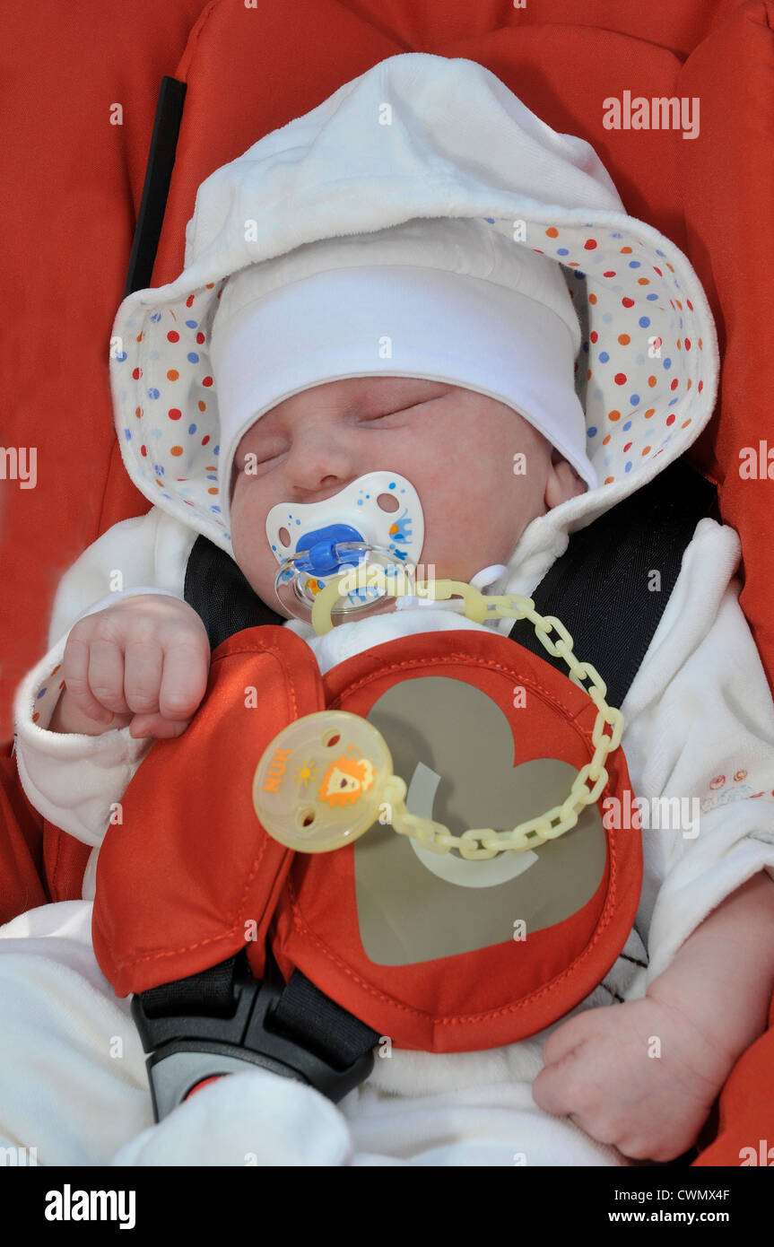 Sleeping Baby with Dummy in Pram Stock Photo Alamy