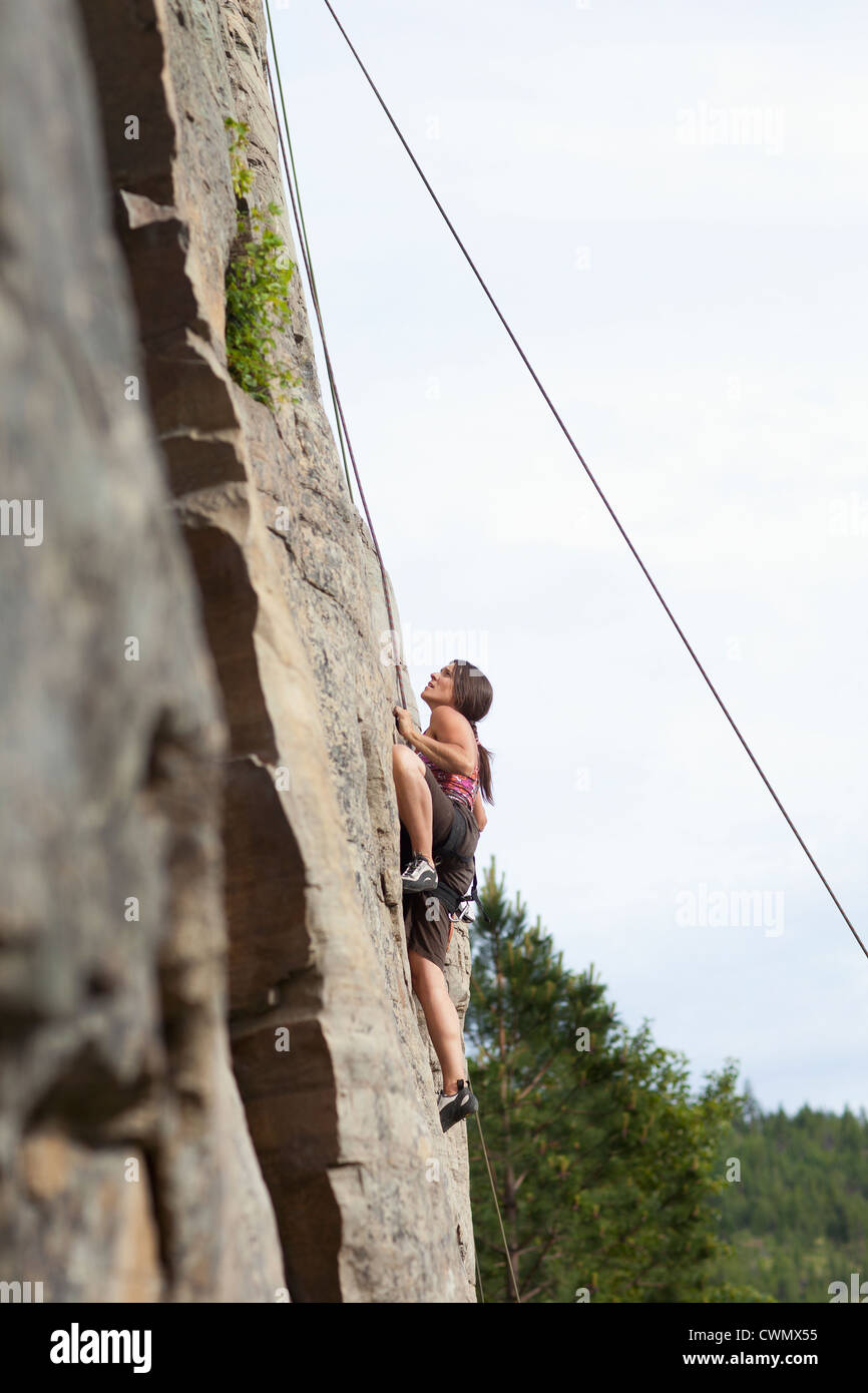 Woman rock climbing Stock Photo - Alamy