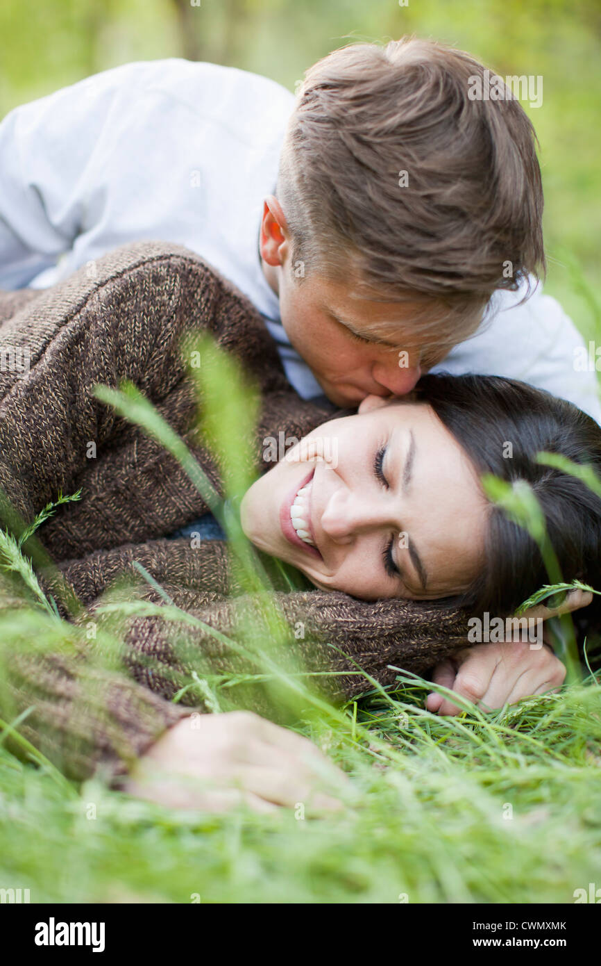 Couple lying down kissing on hi-res stock photography and images - Alamy