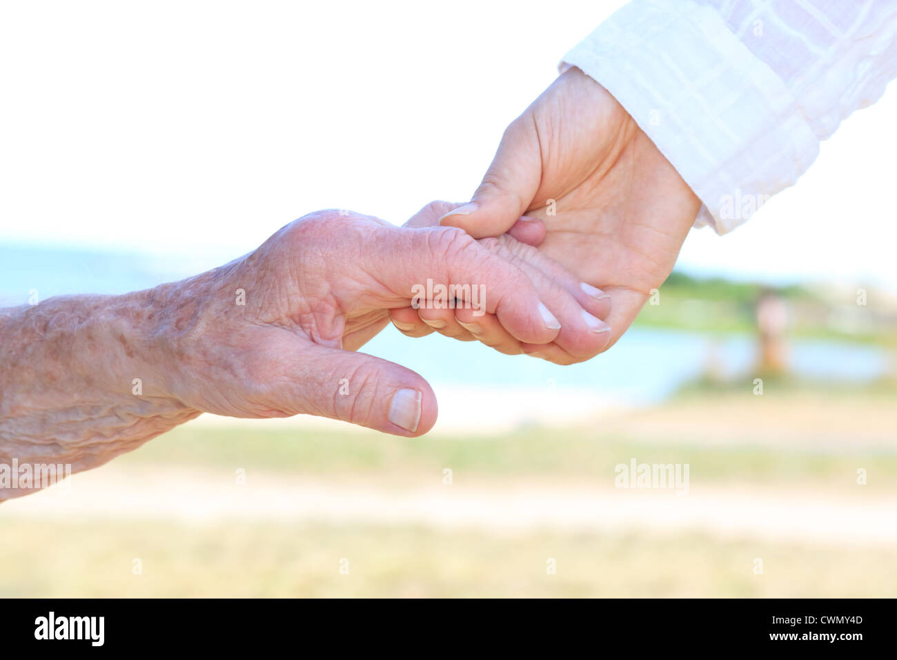 Senior women holding hands with caretaker Stock Photo