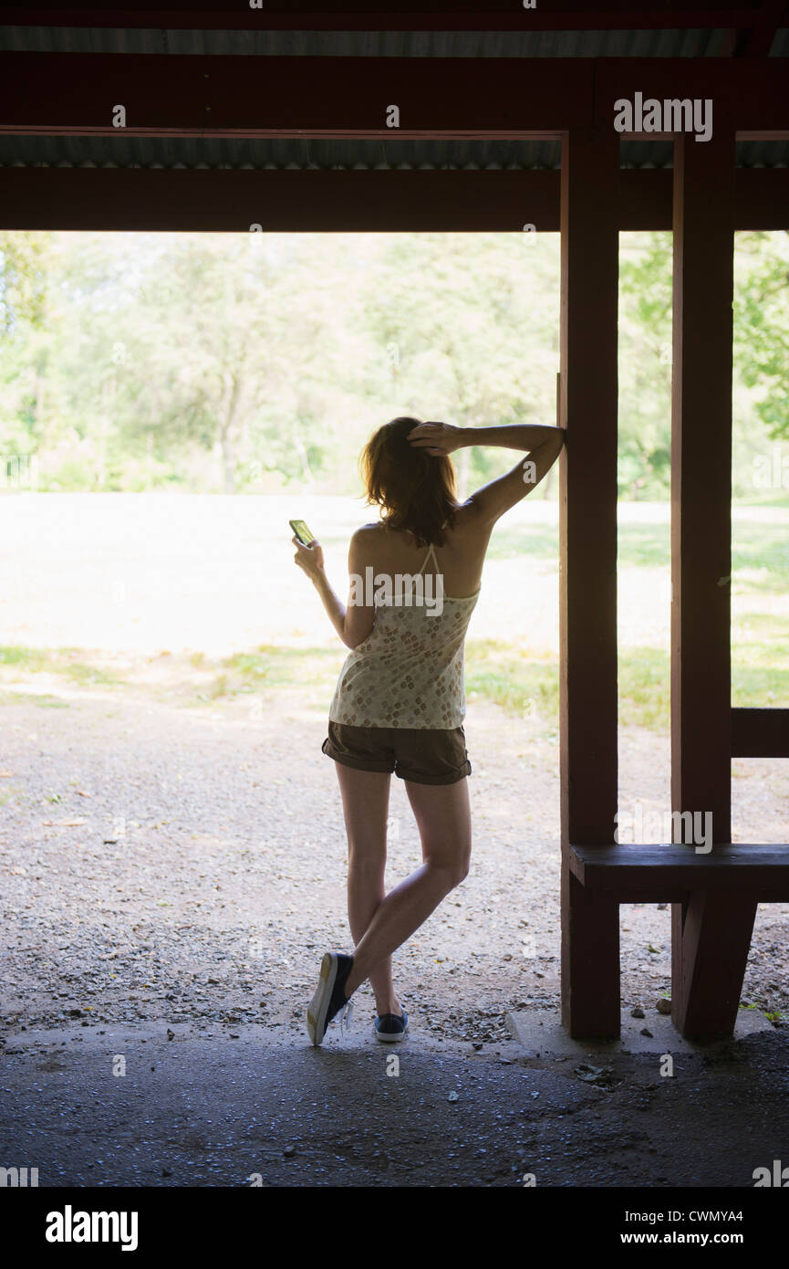 Female rear view mobile texting hi-res stock photography and images - Alamy