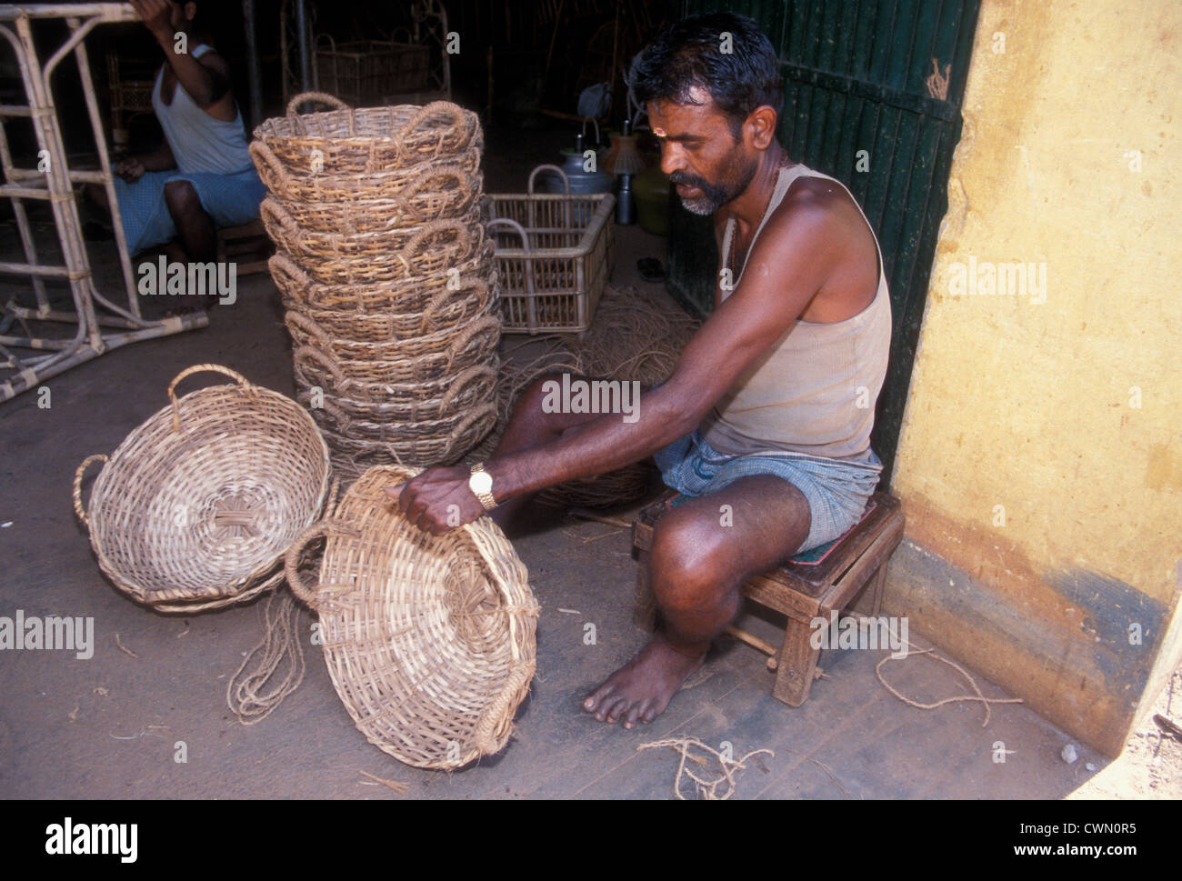 A man weaving baskets in the state of Tamil Nadu, India 2004 Stock