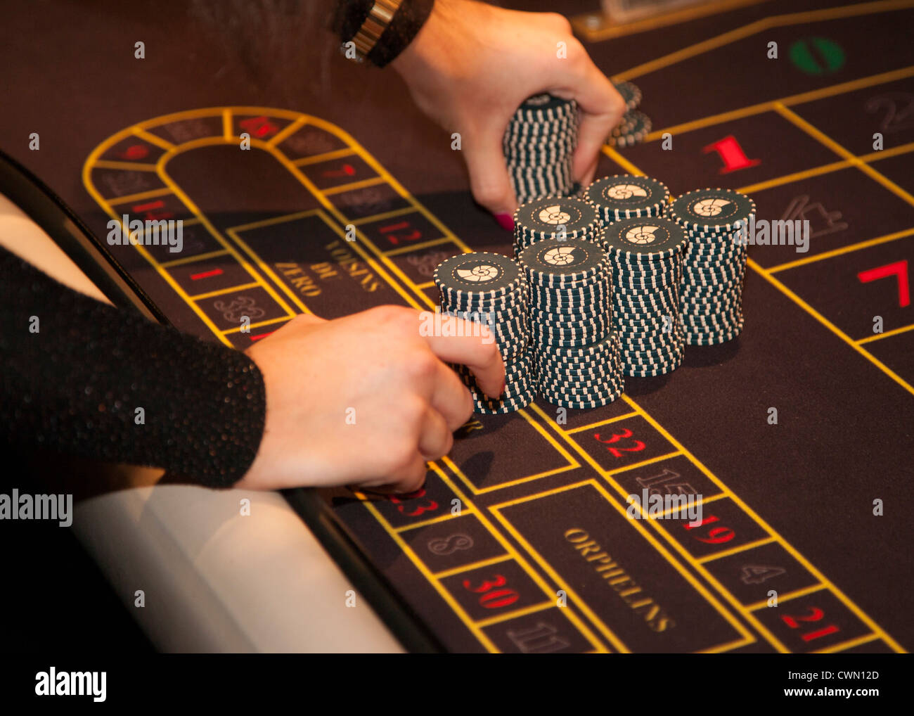 Gambling at roulette wheel Stock Photo - Alamy