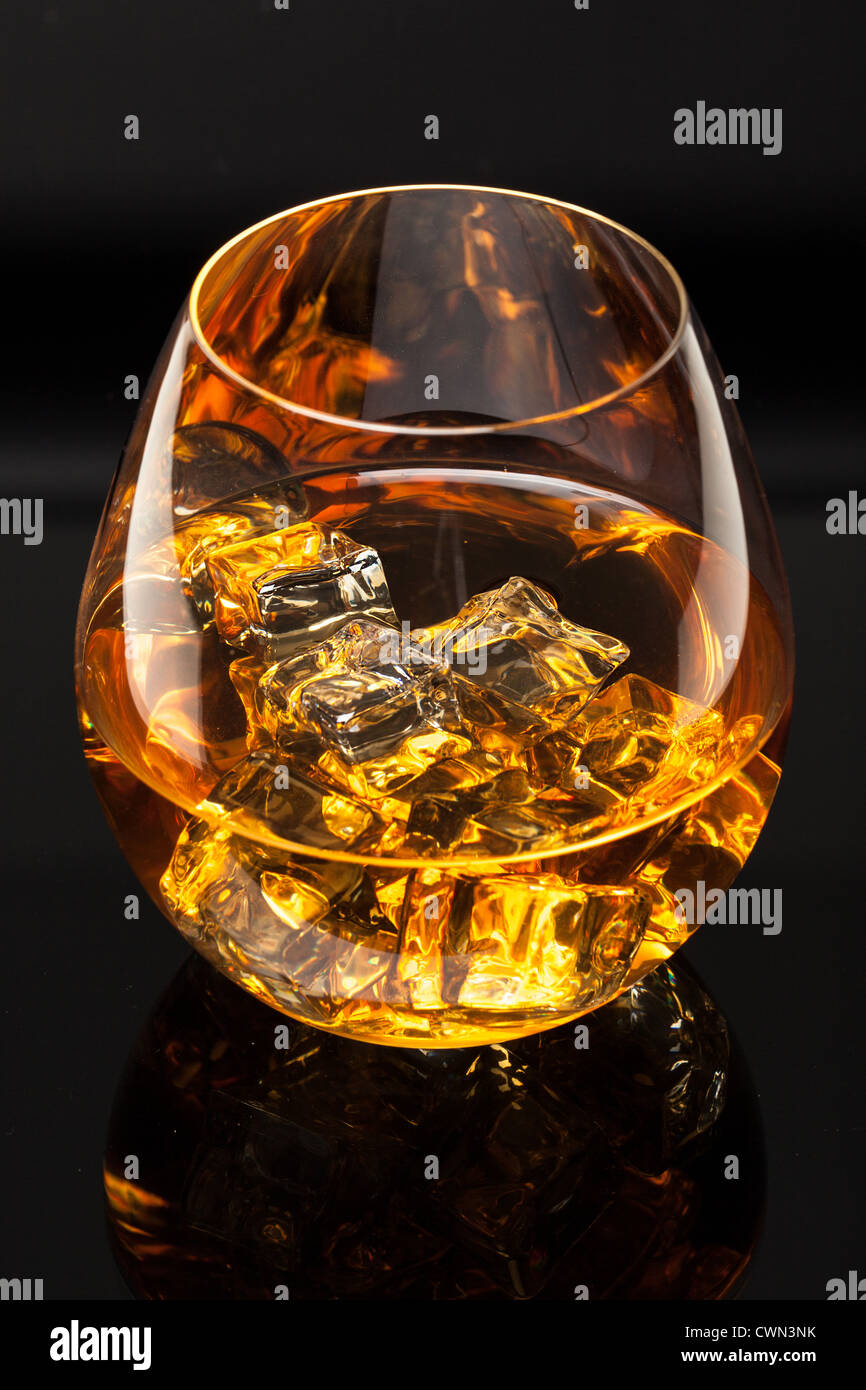 A glass of whiskey on the rocks Stock Photo - Alamy