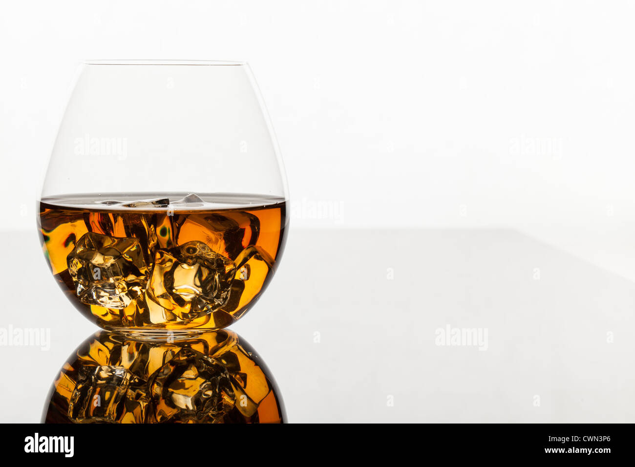 A glass of whiskey on the rocks isolated on white background Stock ...
