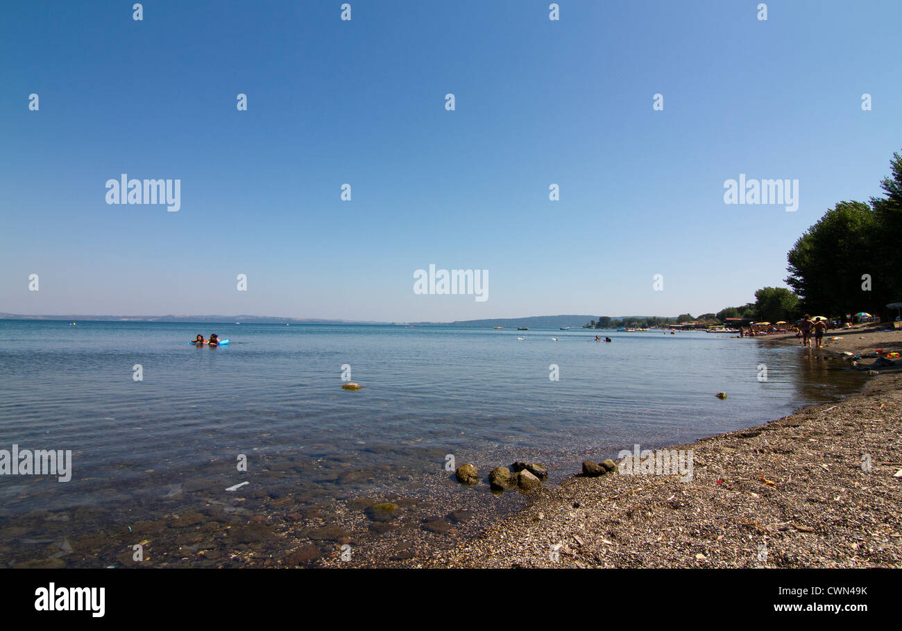 shoreline at Lago di Bracciano in mid August Italy Stock Photo