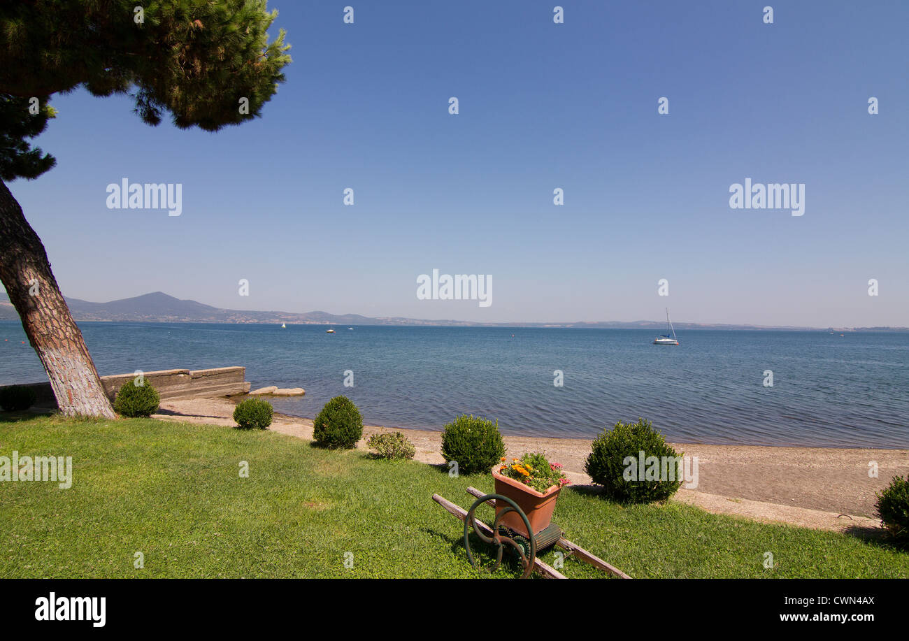 shoreline at Lago di Bracciano in mid August Italy Stock Photo