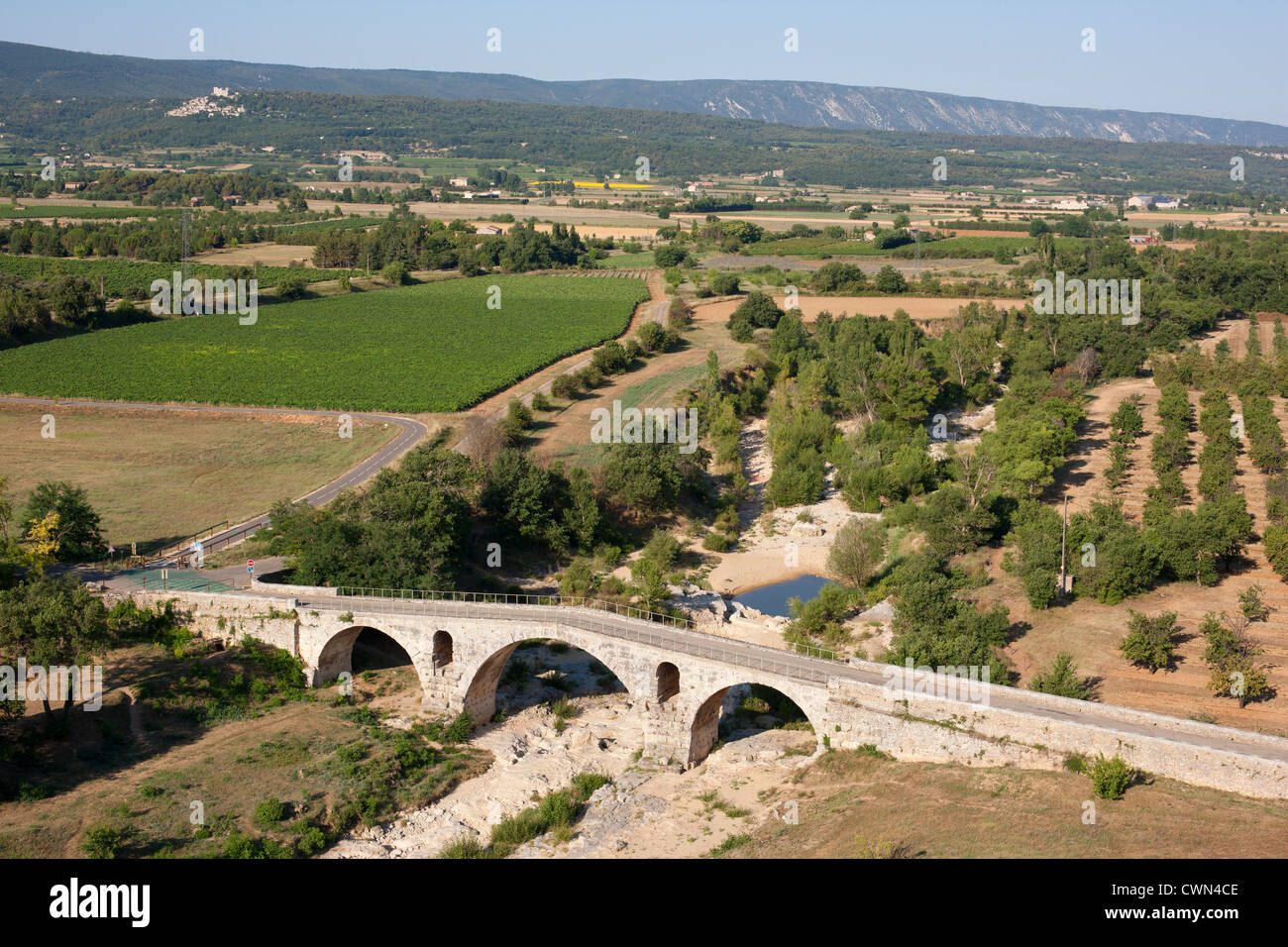 AERIAL VIEW. Pont Julien is a 2000-year-old stone arch Roman bridge on the Via Domitia. Apt, Provence, France. Stock Photo