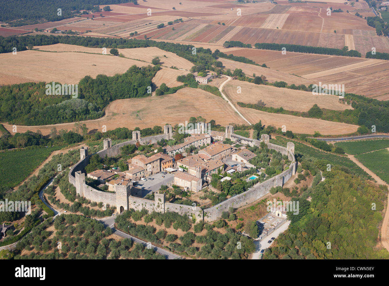 AERIAL VIEW. Medieval walled town. XIII century town built on a hilltop. Monteriggioni, Province of Siena, Tuscany, Italy. Stock Photo