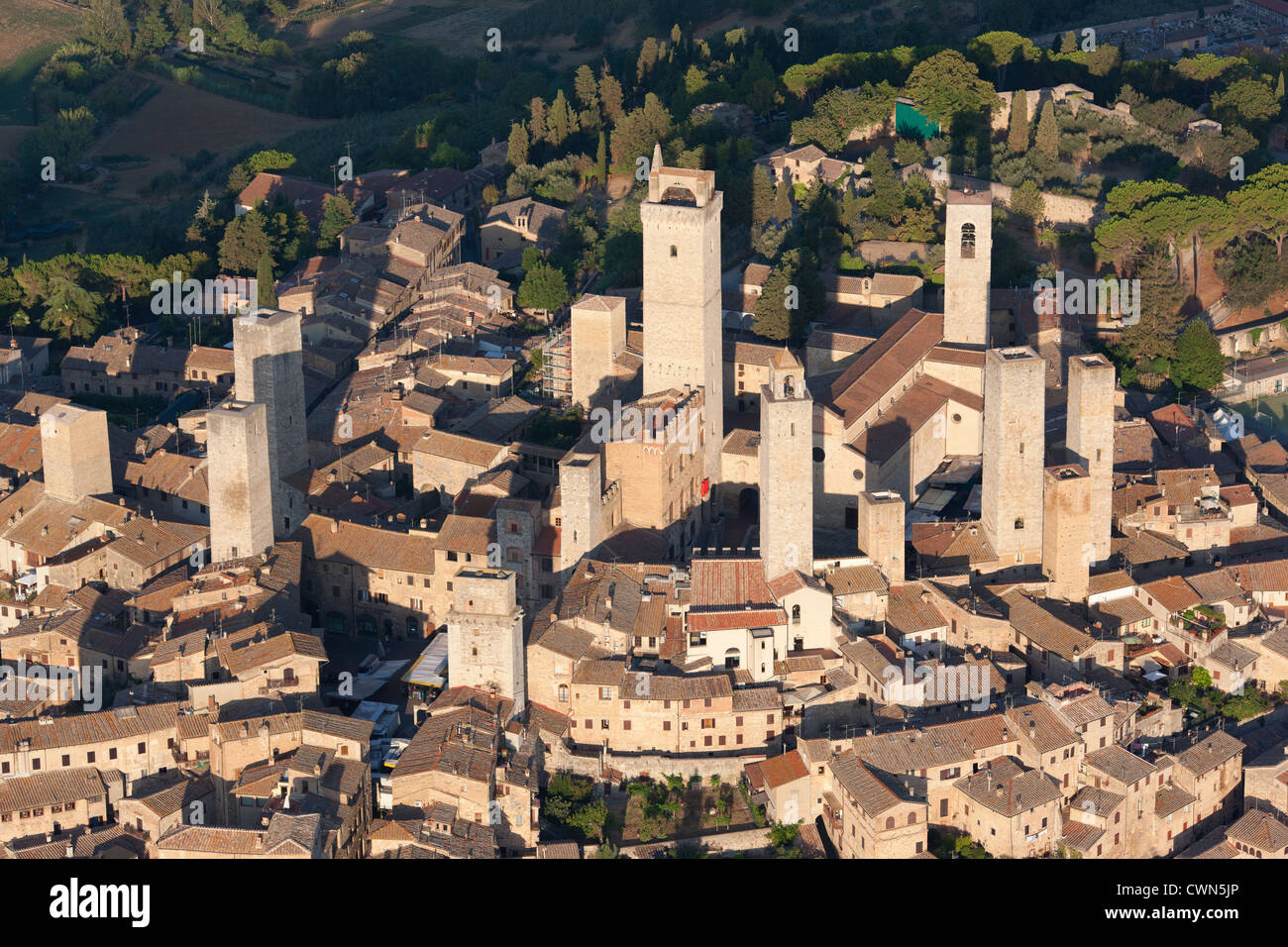 AERIAL VIEW. Medieval hilltop town with its many towers built by rich families centuries ago. San Gimignano, Province of Siena, Tuscany, Italy. Stock Photo