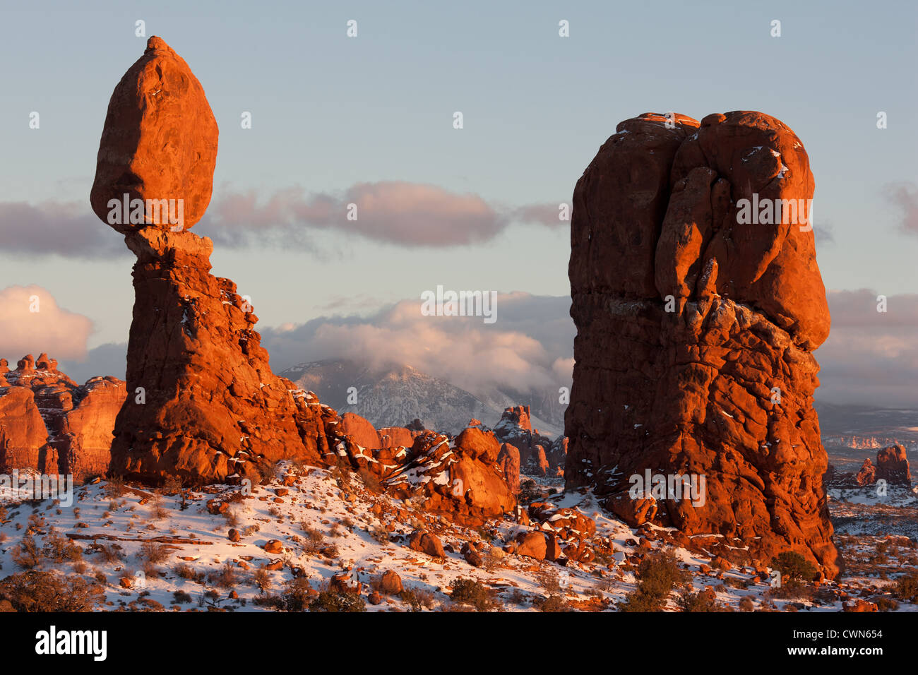 Sunset glow on Balanced Rock, a red sandstone hoodoo in Arches National Park. Grand County, Utah, USA. Stock Photo