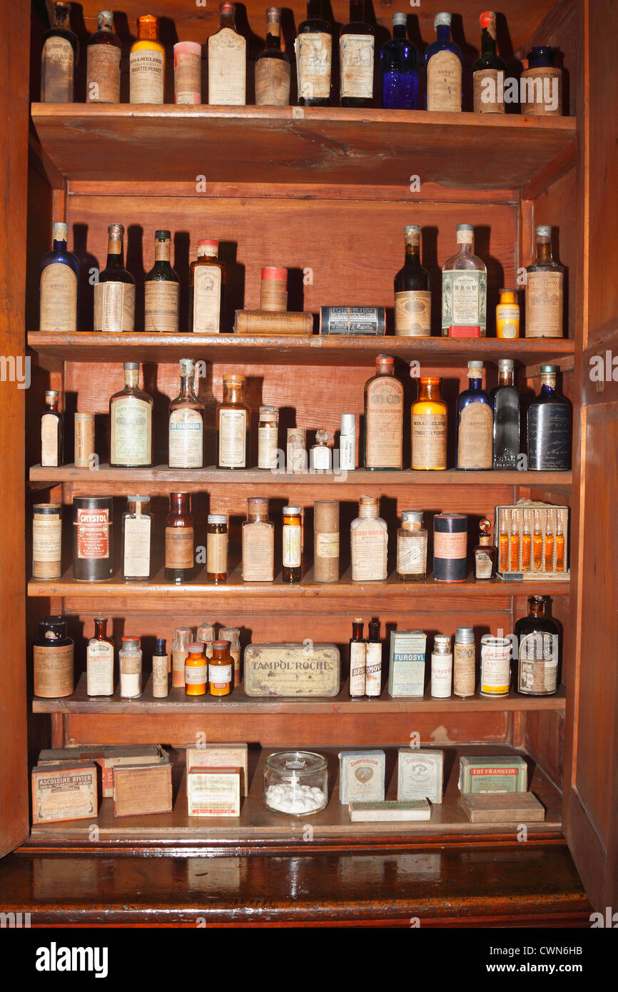 Vintage medical pharmaceutical colorful chemical bottles on the shelf or table. Vintage old medical chemist's shop, chemistry Stock Photo