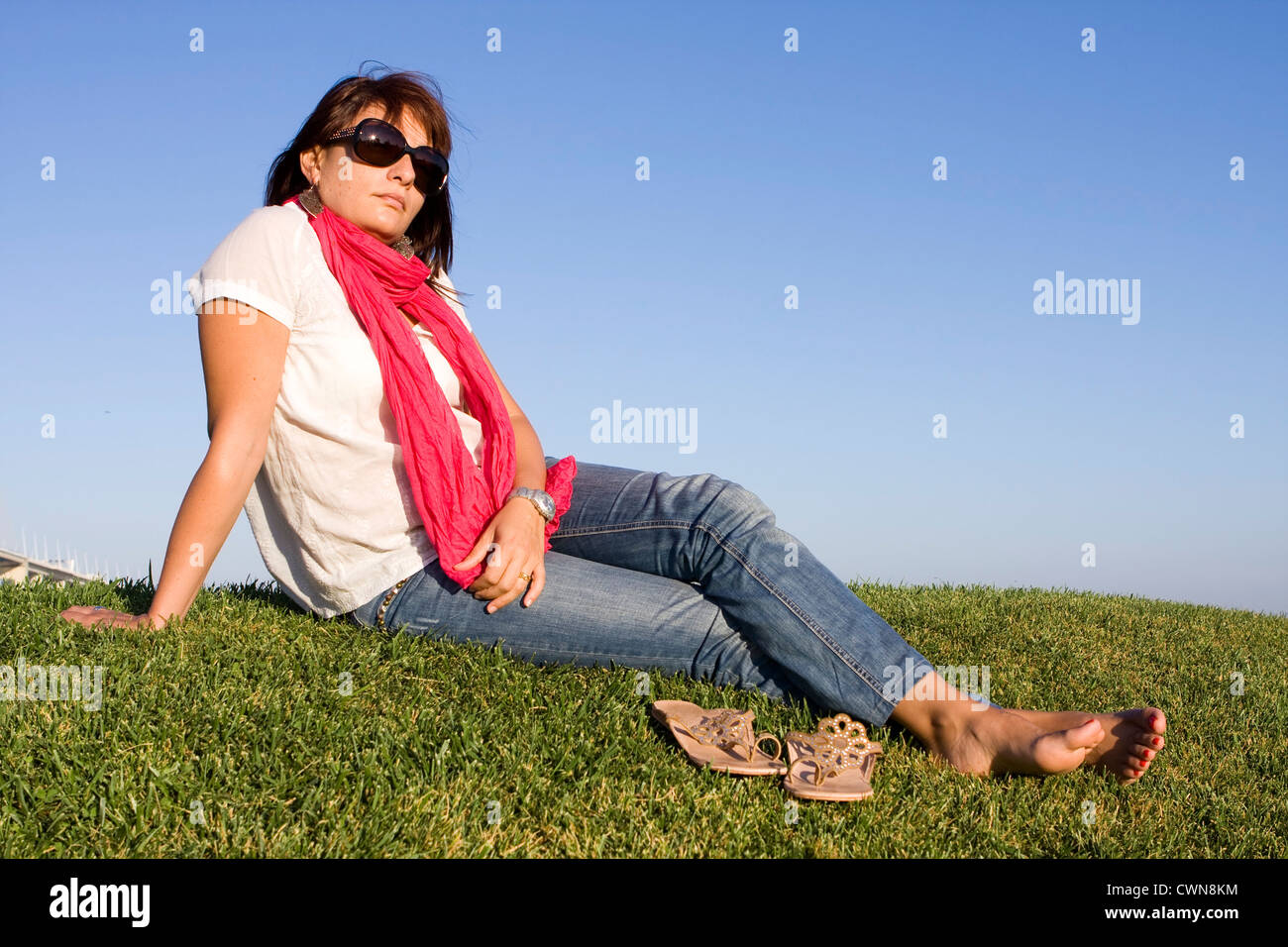 Girl relaxing on grass hi-res stock photography and images - Alamy