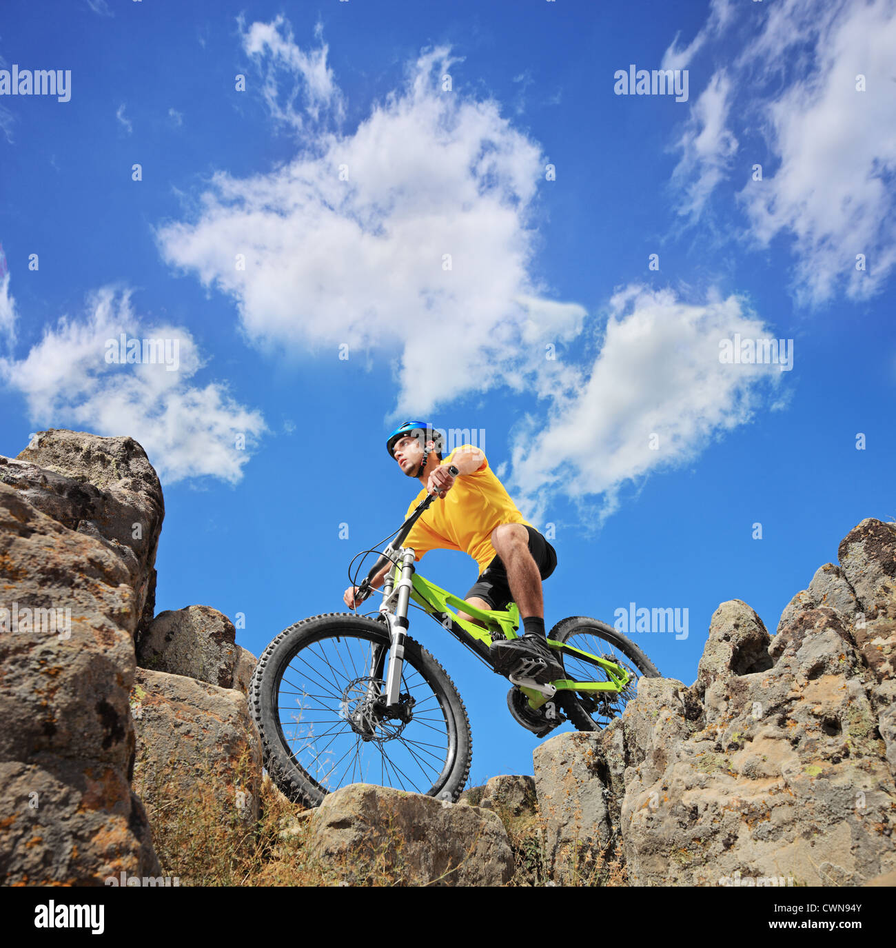 A person riding a mountain bike on a sunny day, low angle view Stock Photo