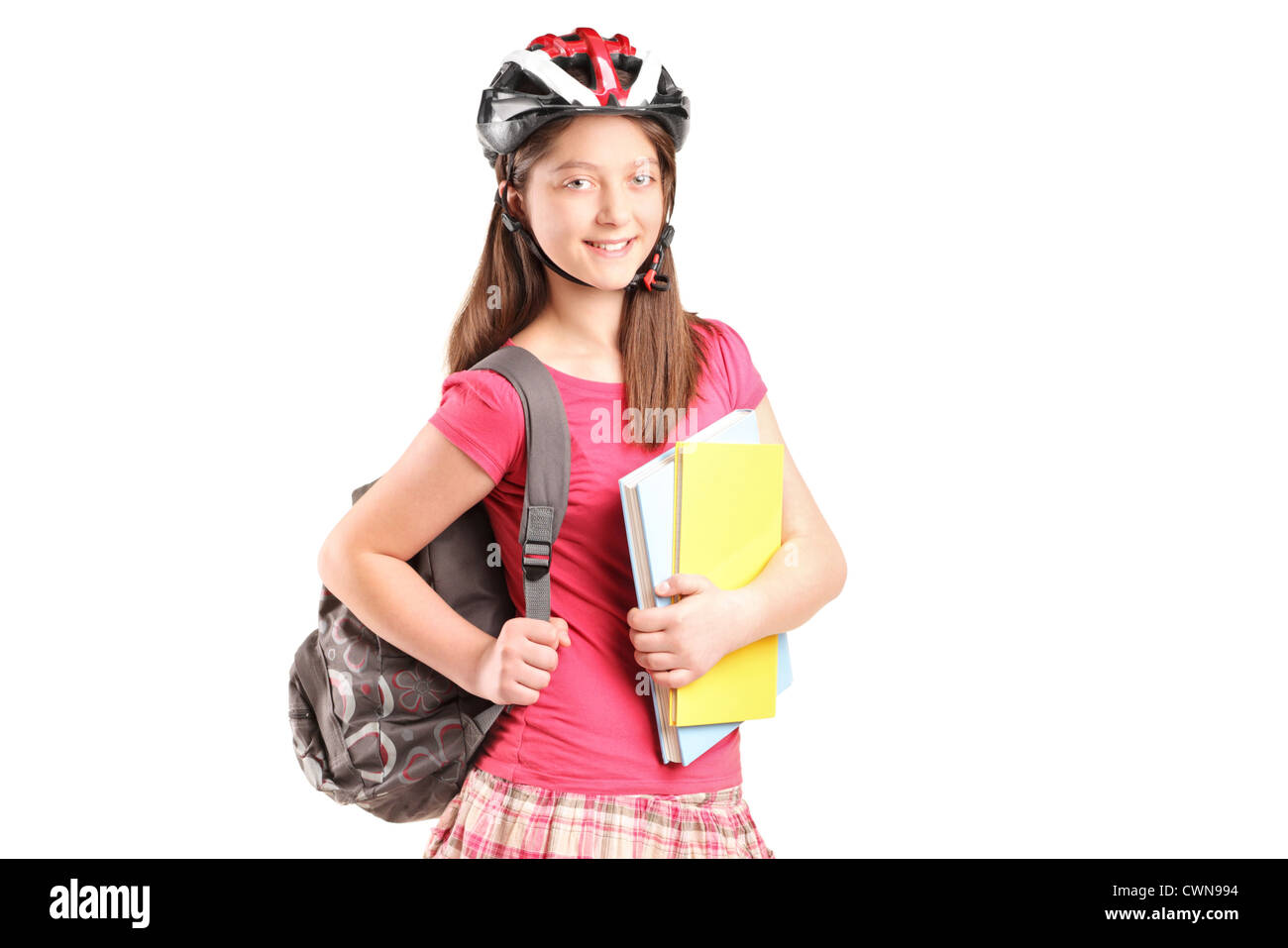 A girl on rollers holding notebooks isolated against white background ...