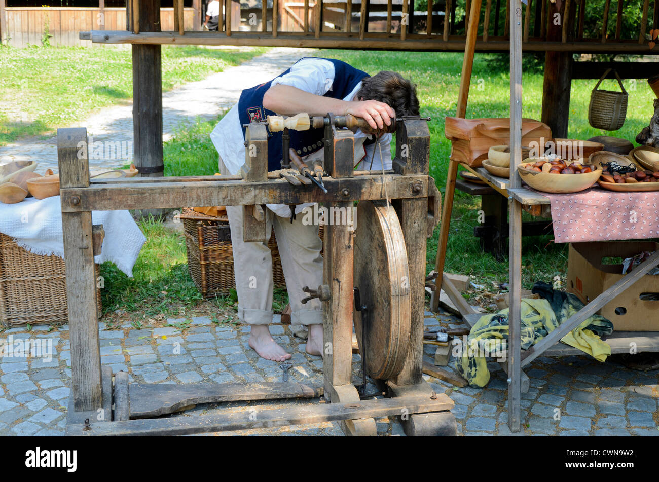 Woodworker in Roznov wooden village museum Stock Photo