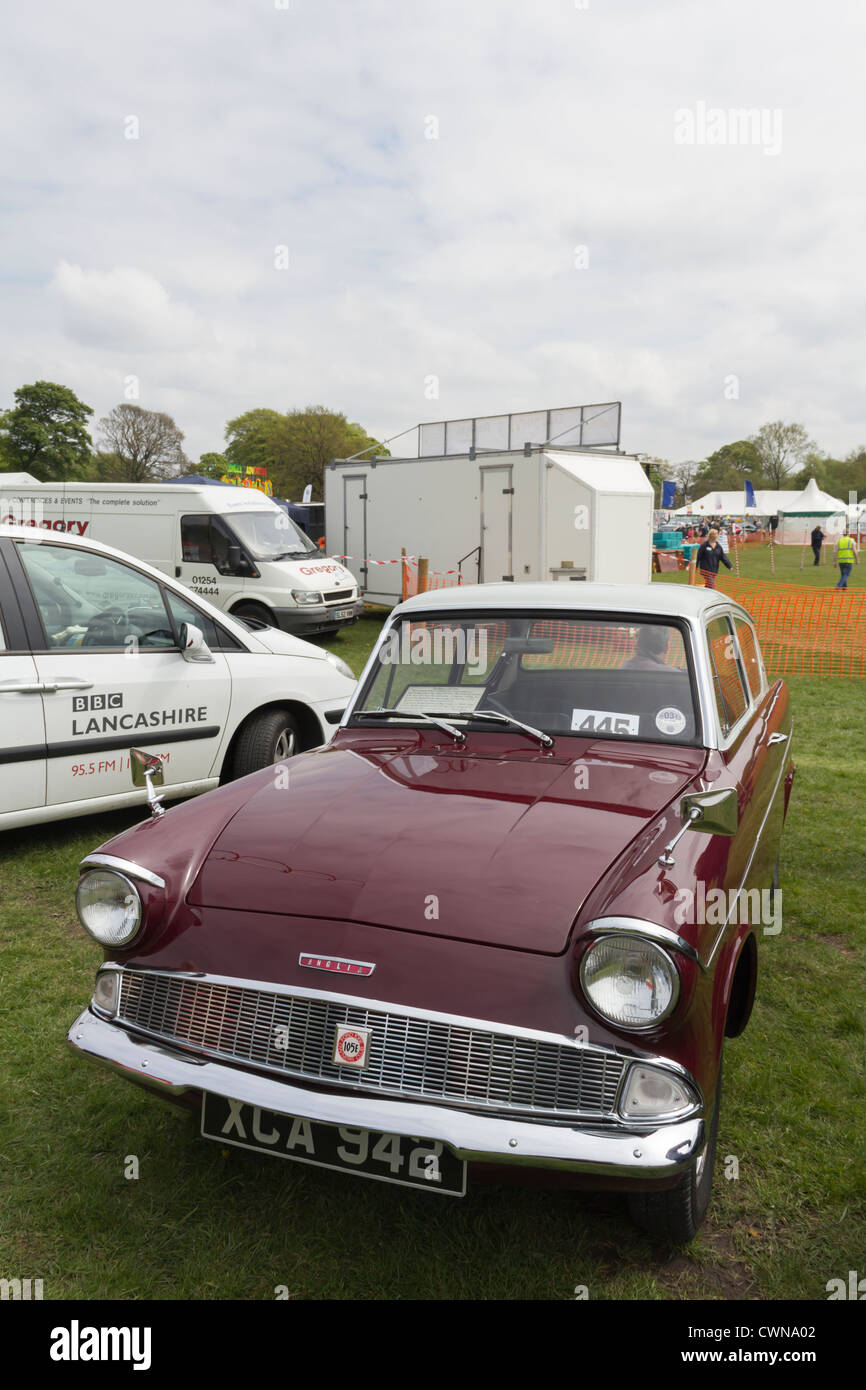 A deep maroon Ford Anglia classic car displayed at the Lancashire Countryside Experience Day at Witton Country Park in May 2012. Stock Photo