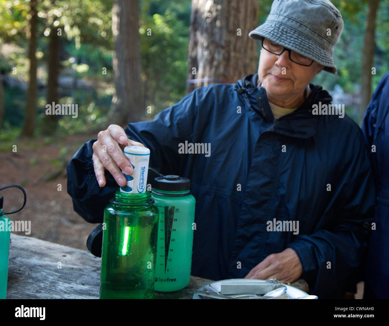 Algonquin Provincial Park, Ontario Canada - A backcountry camper purifies water with a SteriPEN Stock Photo