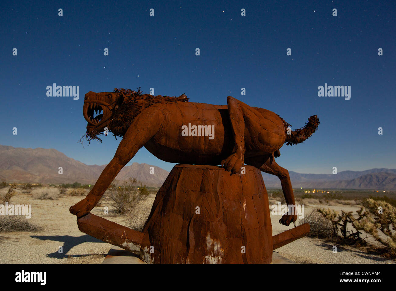Saber tooth tiger sculpture located in Borrego Springs CA at night under the stars Stock Photo