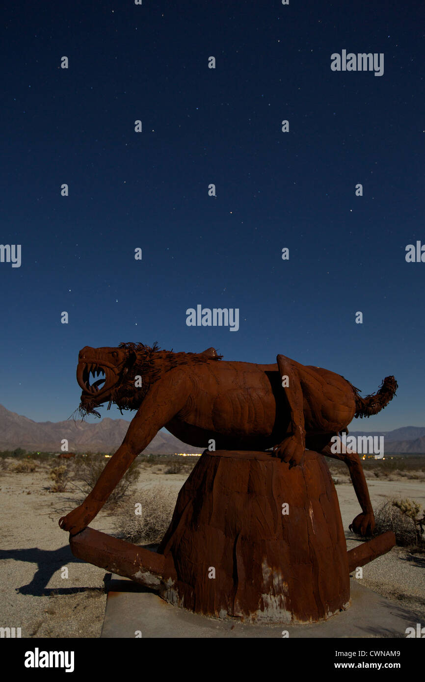 Saber tooth tiger sculpture located in Borrego Springs CA at night under the stars Stock Photo