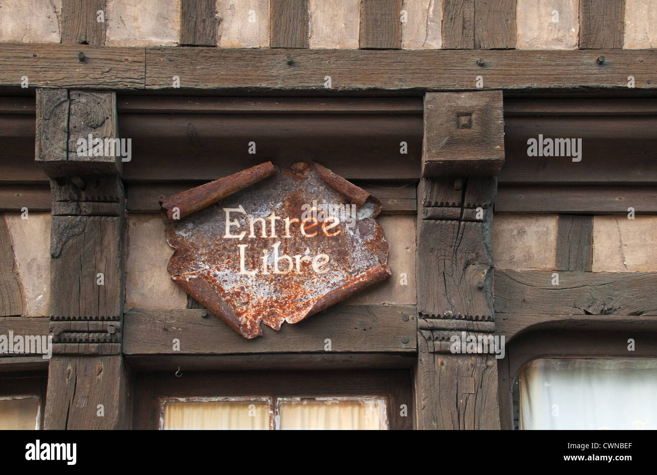 Rusty entrance sign at a half-timbered building at the seaside resort of Étretat, Haute-Normandie, France. Stock Photo