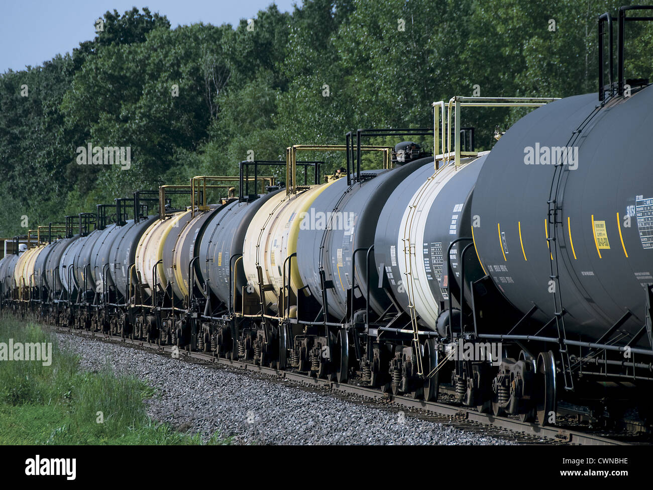 A string of railroad tank cars on a freight train in Indiana Stock Photo