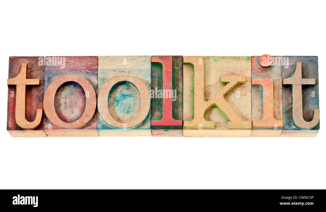 toolkit - a set of tools or software -isolated word in vintage letterpress wood type stained by color inks i Stock Photo