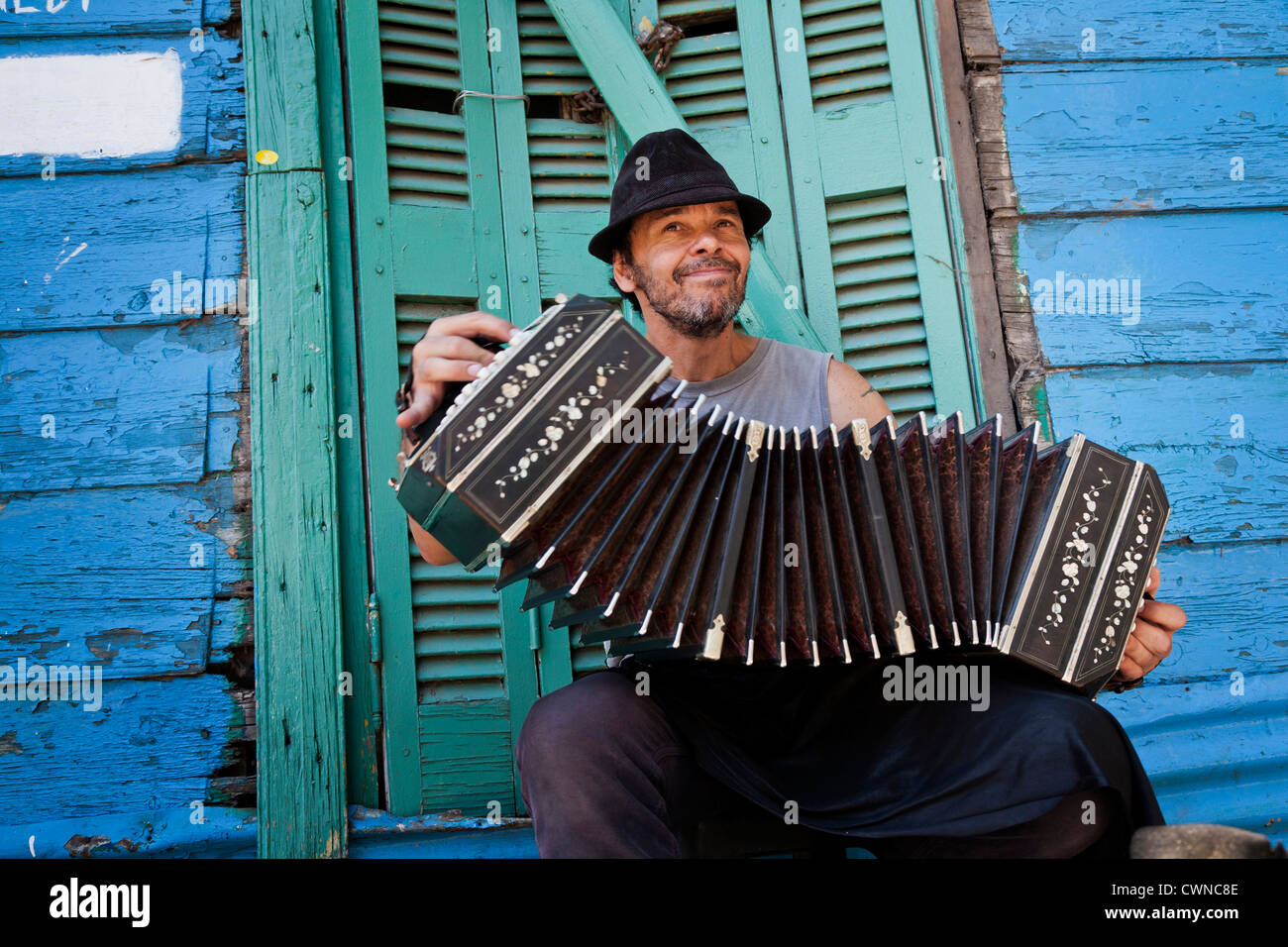 Musician playing the bandeon at Caminito area in La boca. Buenos Aires, Argentina Stock Photo