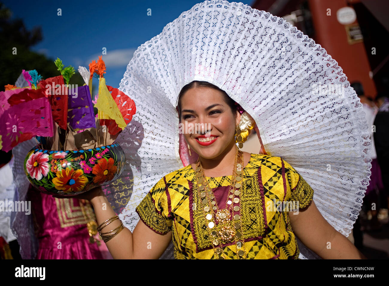 A Tehuana dancer smiles during the Guelaguetza parade in Oaxaca, Mexico Stock Photo