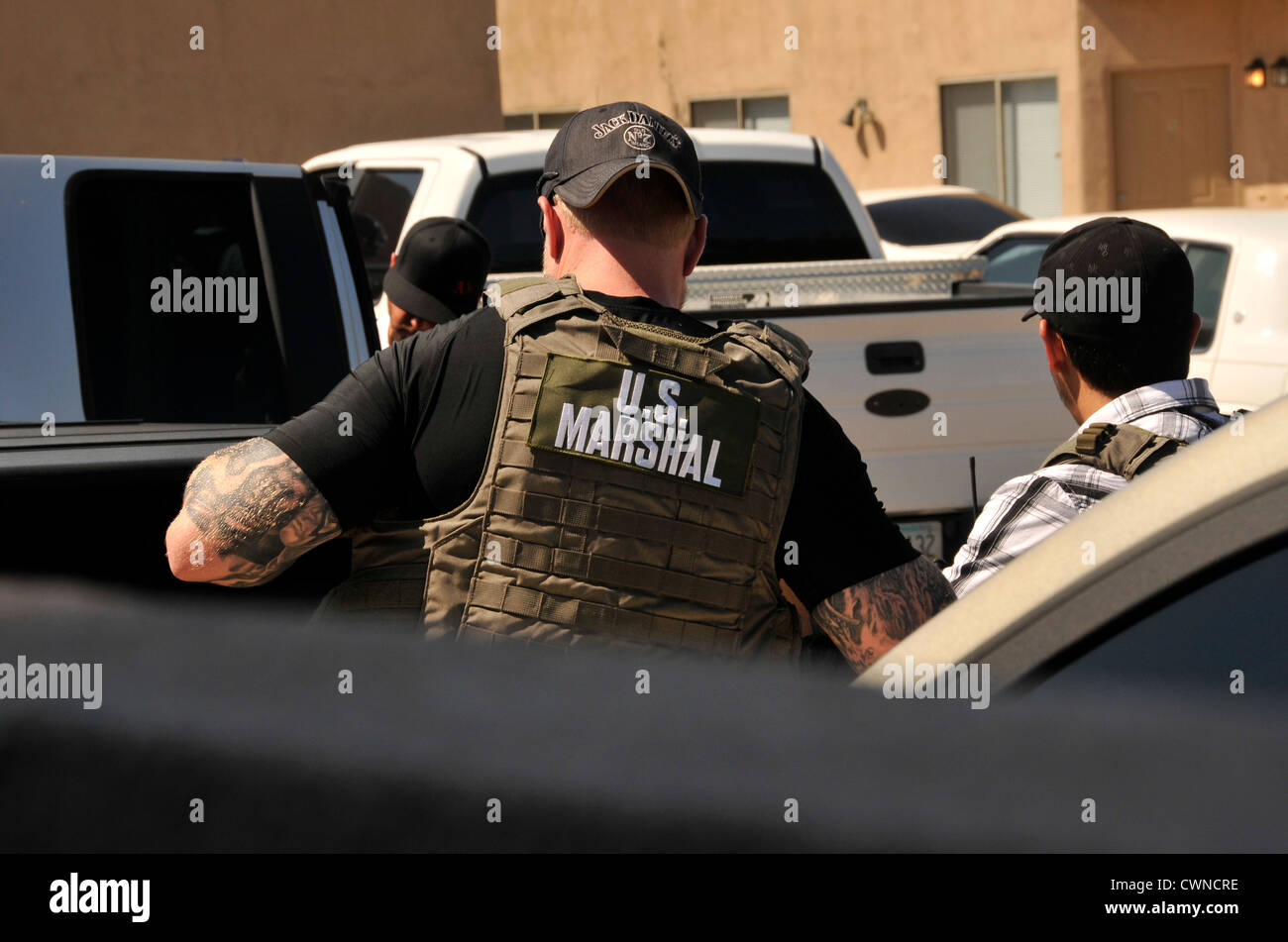 Undercover and law enforcement officers from a multi-task force conduct a drug bust in Tucson, Arizona, USA. Stock Photo