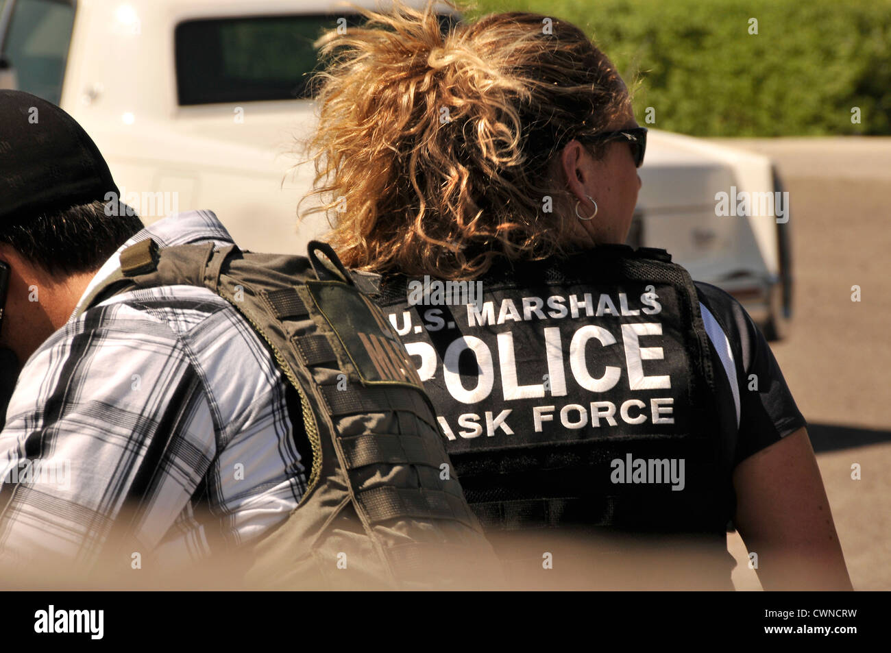 Undercover and law enforcement officers from a multitask force conduct