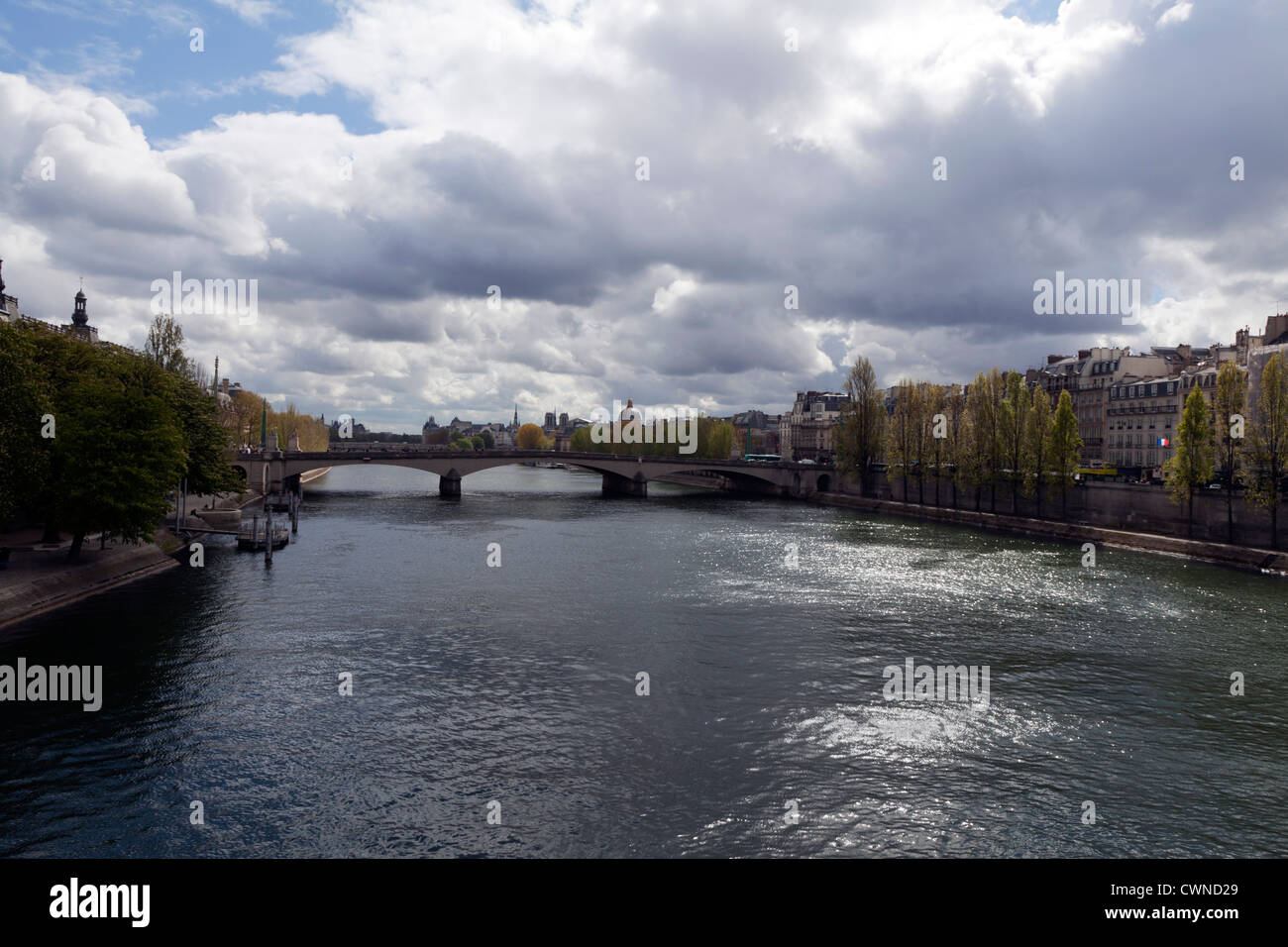 A burst of light over the Seine on an overcast spring day in Paris, France. Stock Photo