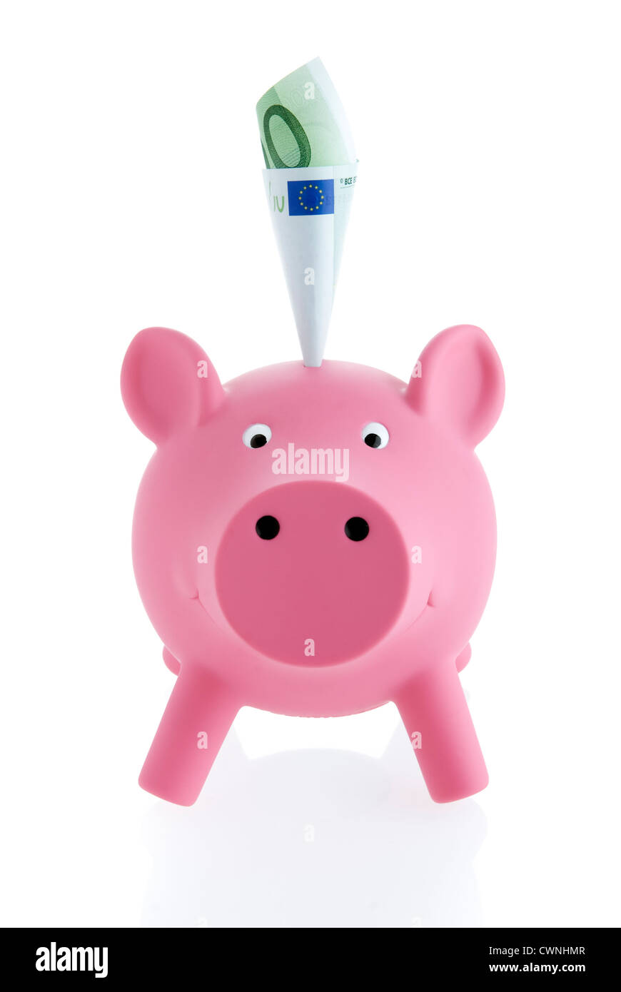 Pink piggy bank with a banknote, isolated on 100% white background Stock Photo