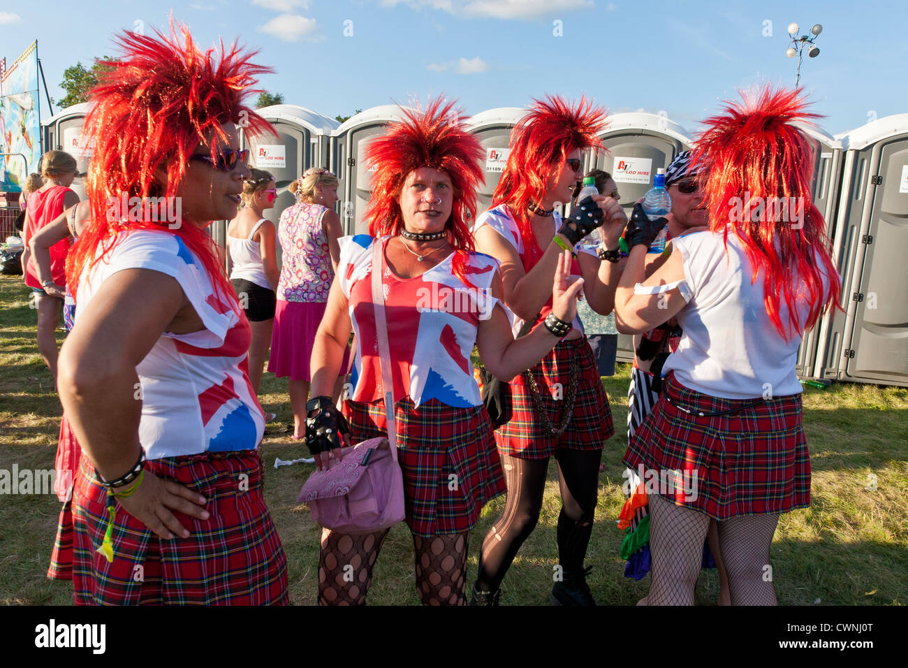 Festival goers with red wigs at the Rewind Festival Henley on Thames 2012. JMH6031 Stock Photo