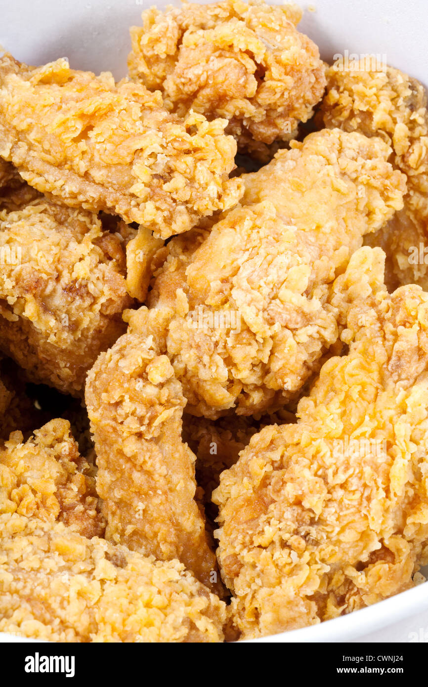 hot fried chicken wings in basket close up Stock Photo Alamy