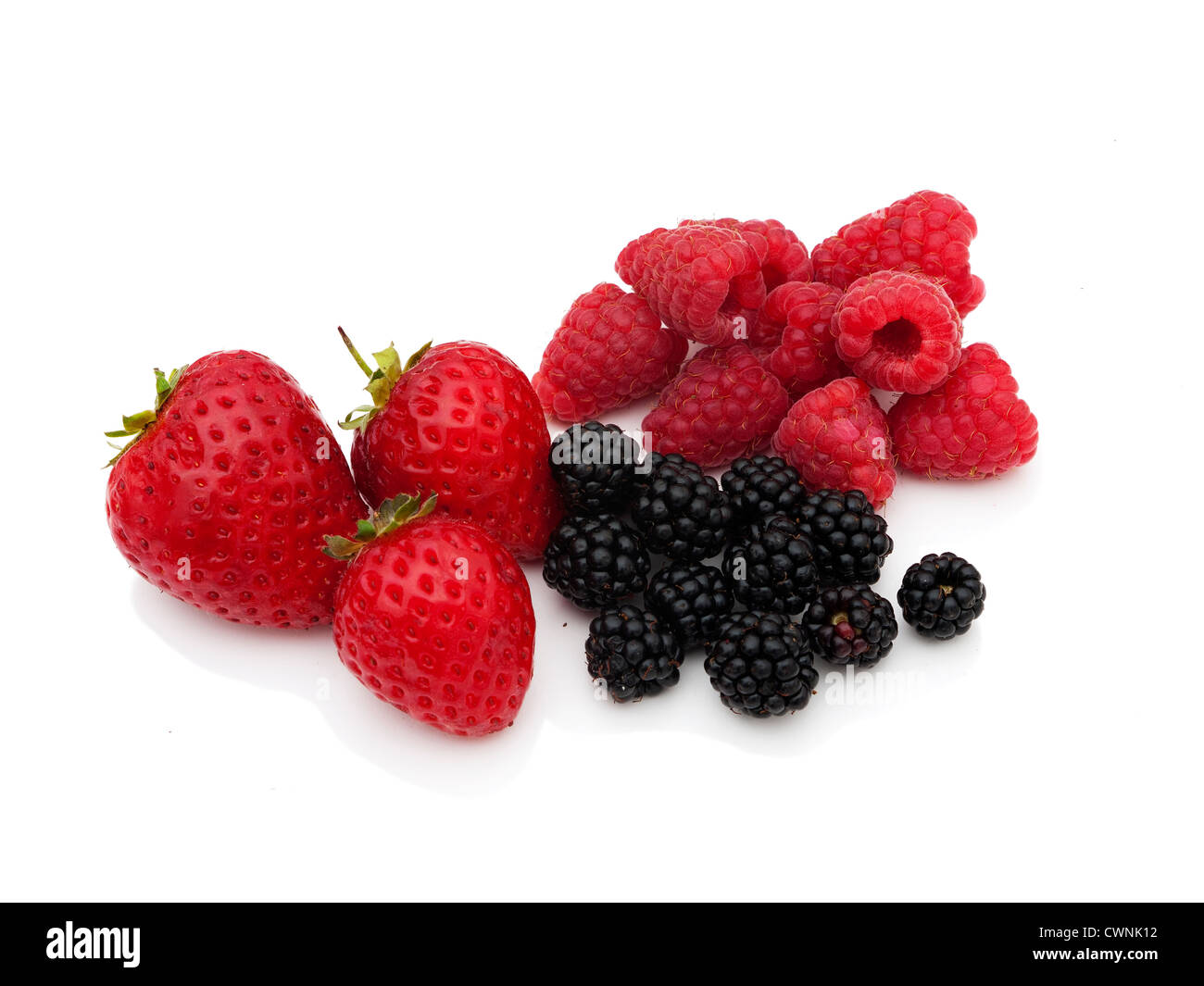 Fresh strawberries, raspberries and blackberries over white Stock Photo ...