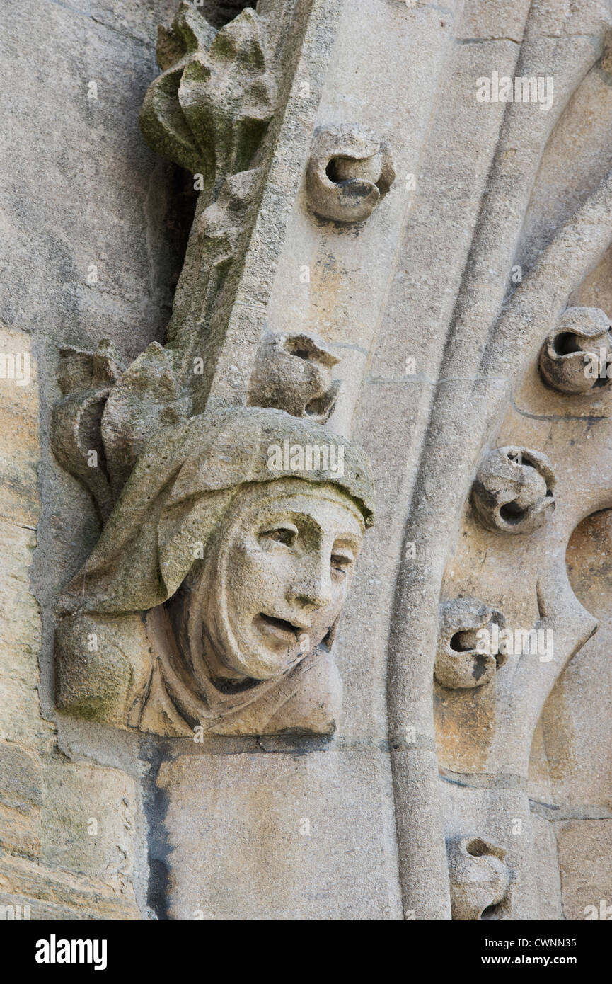 Carved stone womans head on the tower of the University Church of St Mary the Virgin, Oxford, England Stock Photo