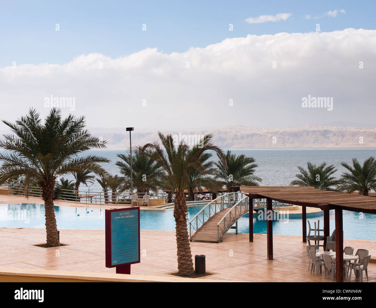 Pool for fresh water swimming next to the Dead Sea with the West Bank in the background Stock Photo
