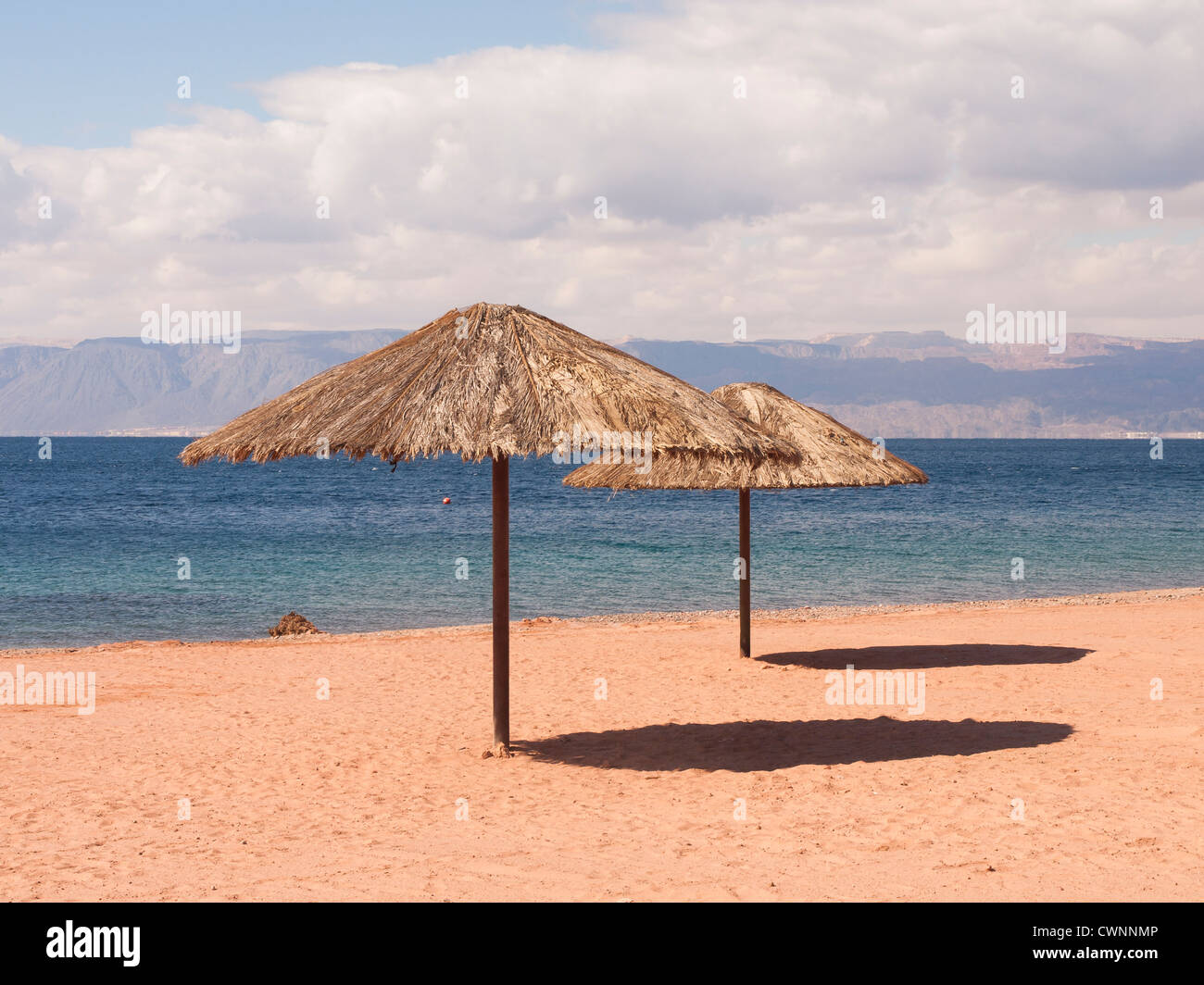 Sun sea and beach at Tala Bay outside of Aqaba Jordan on the Red sea with Sinai in the background Stock Photo