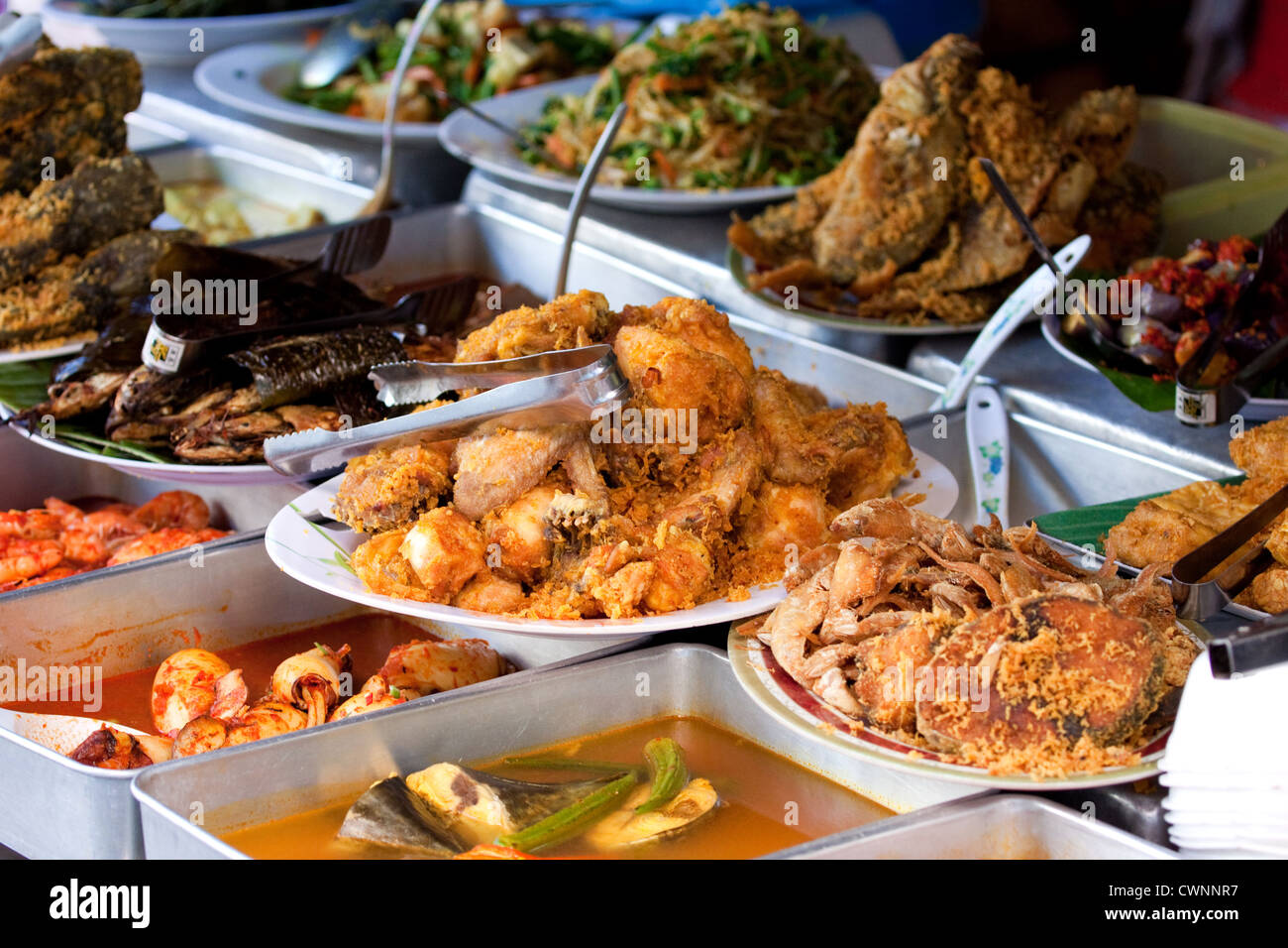 Malaysian Street Food Displayed At An Outdoor Food Stall With A Wide 