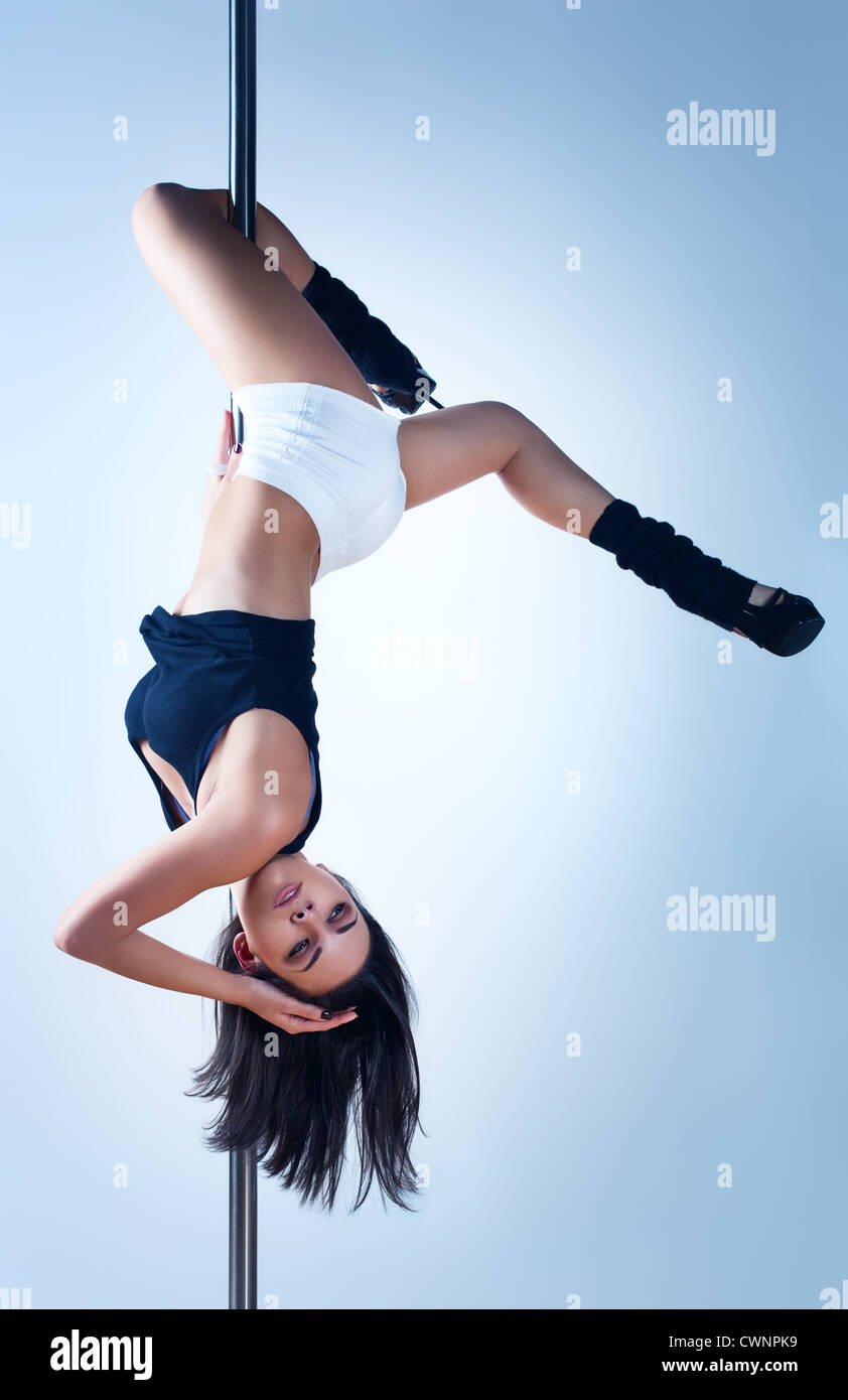 Young slim pole dance woman. Stock Photo