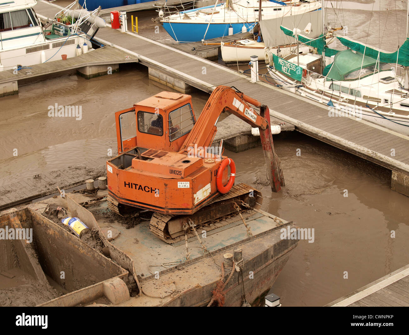 Silt being dredged from Watchet Harbour. Somerset. UK Stock Photo
